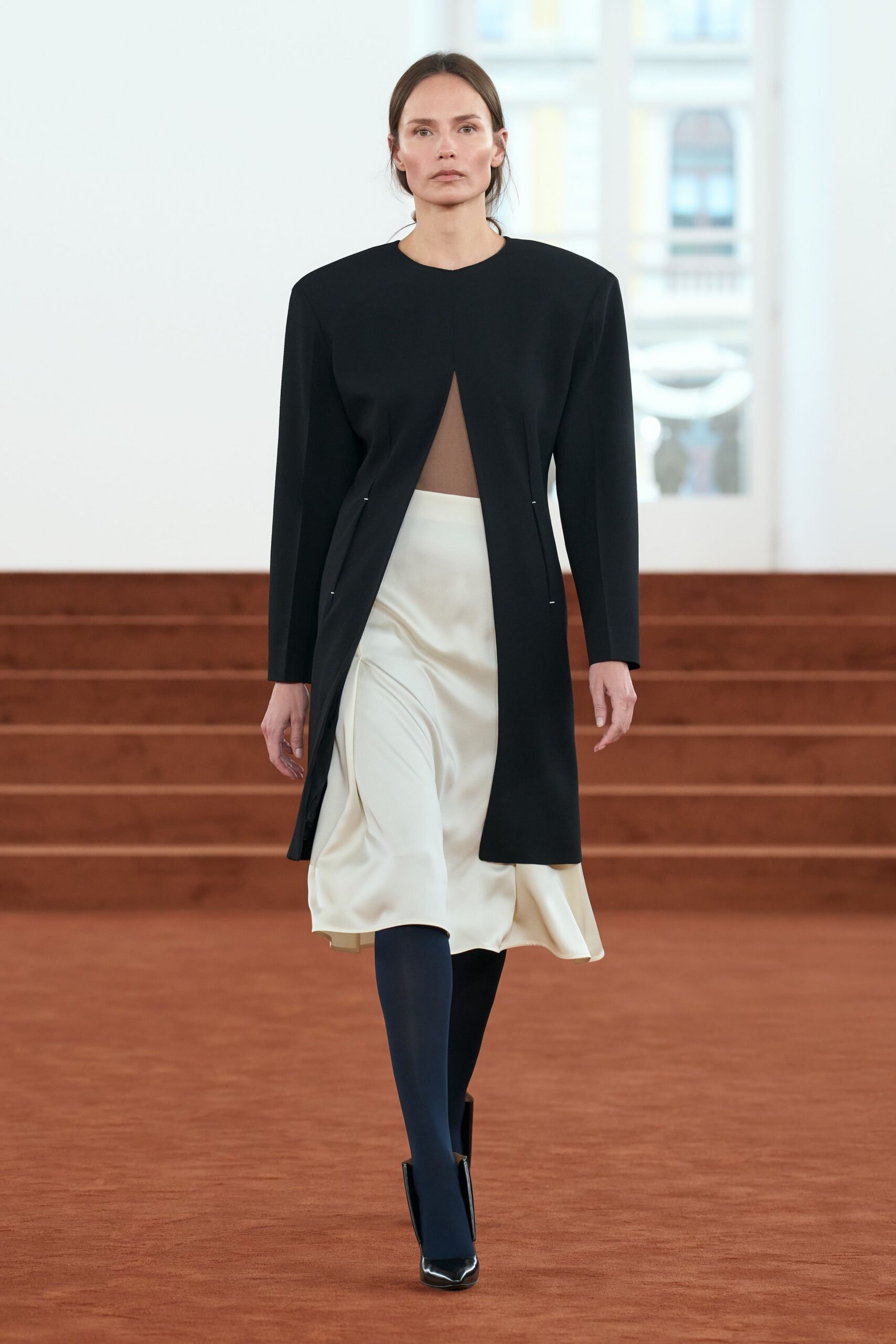 black wool long-sleeve collared structured buttoned coat