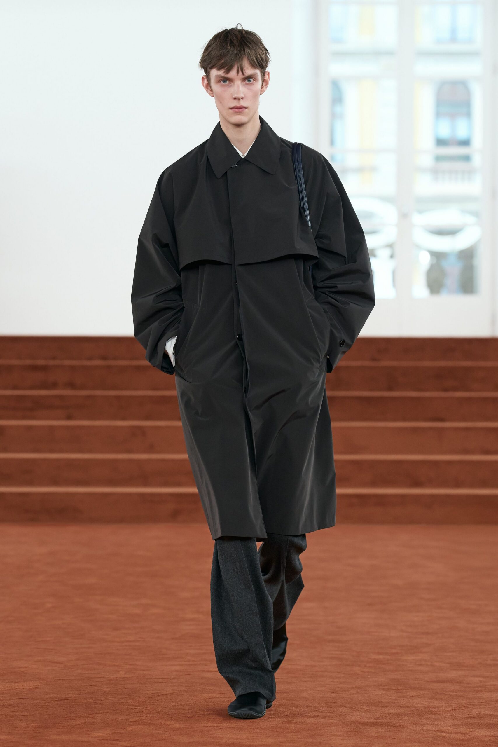 black relaxed coat with gray pants