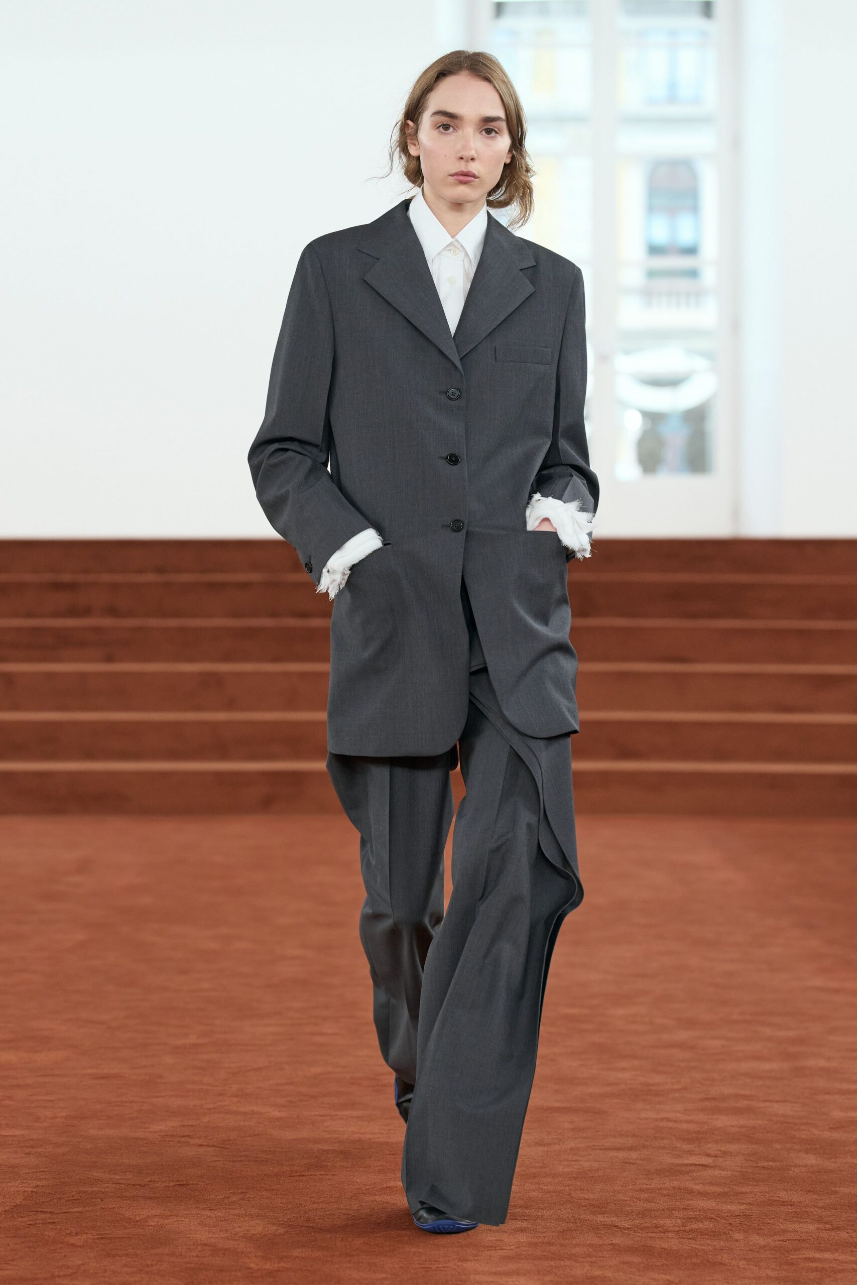 gray tailored suit with blue shoes