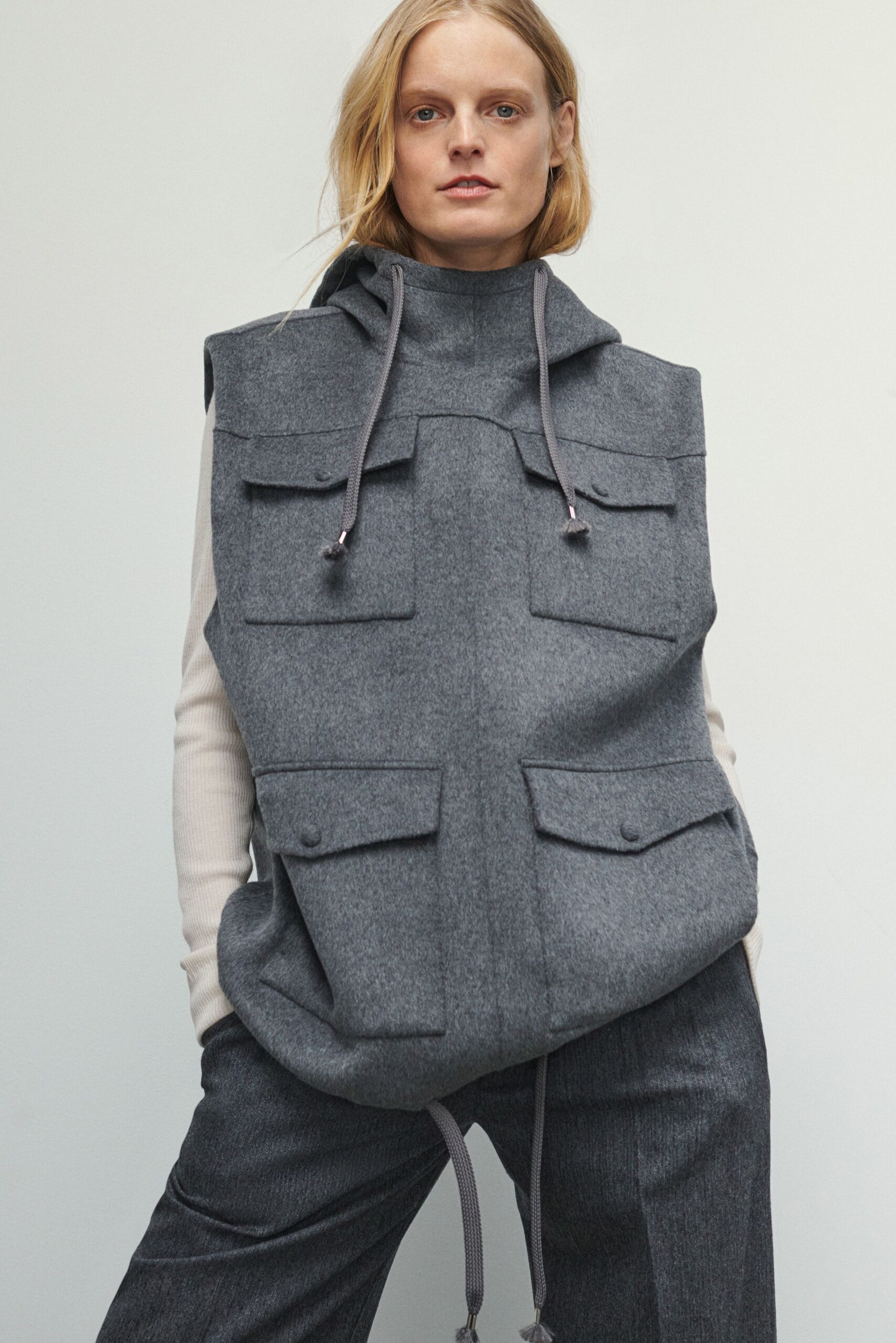 gray wool sleeveless top and tailored pants