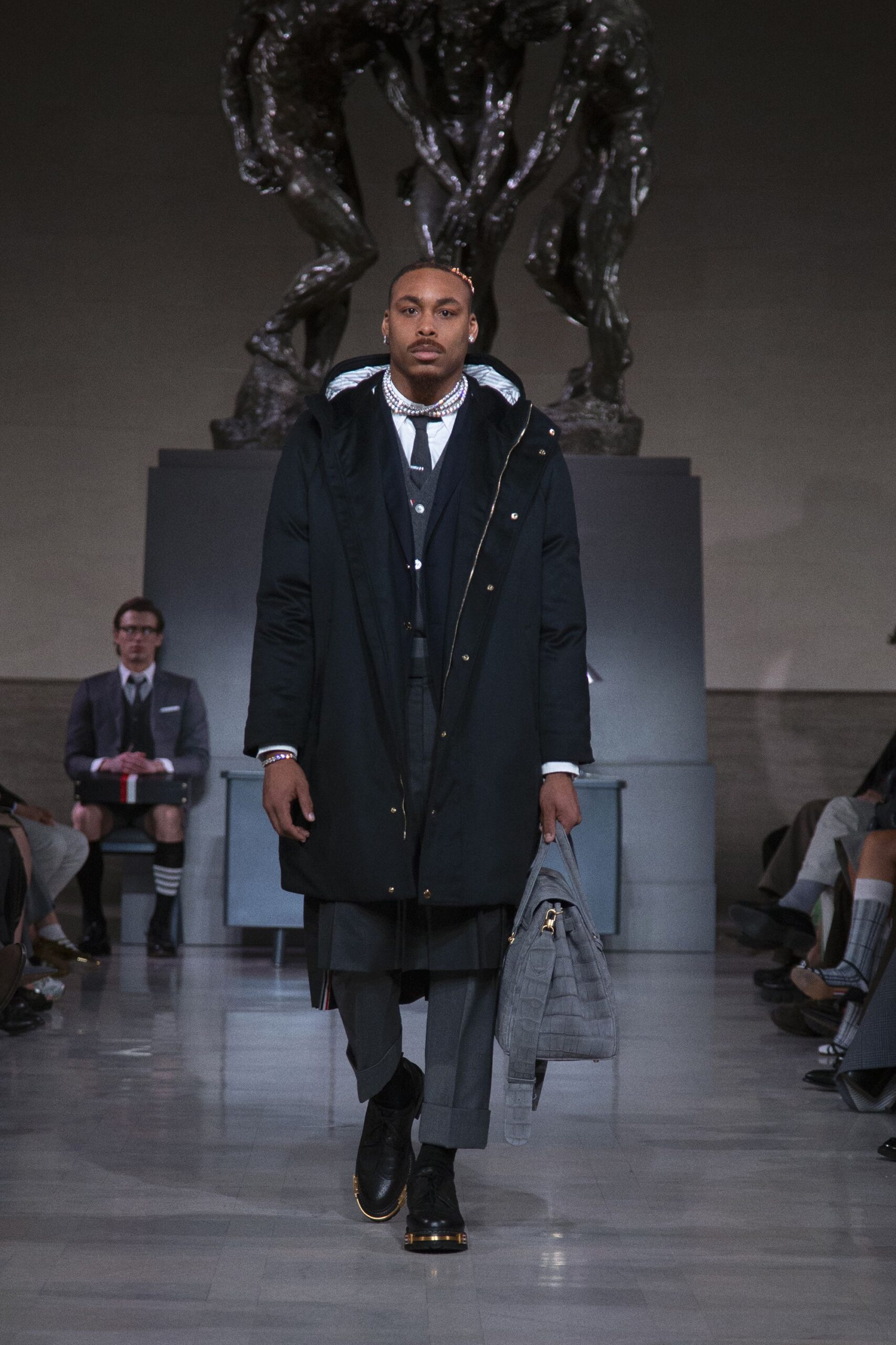 black coat gray suit pants