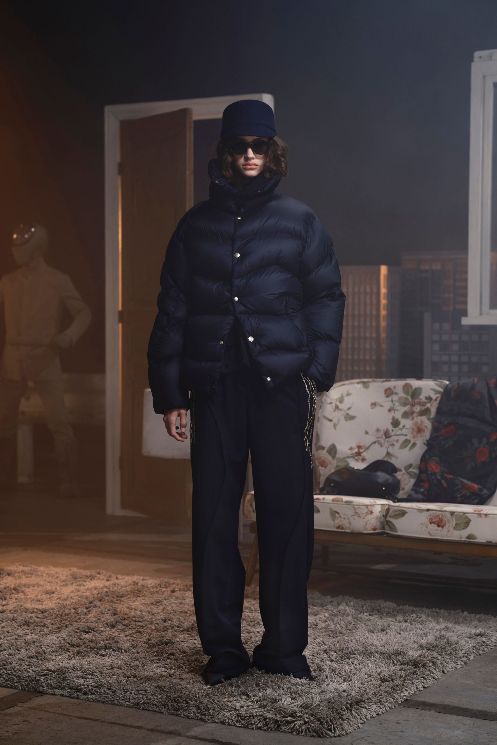 black puffer jacket and tailored pants