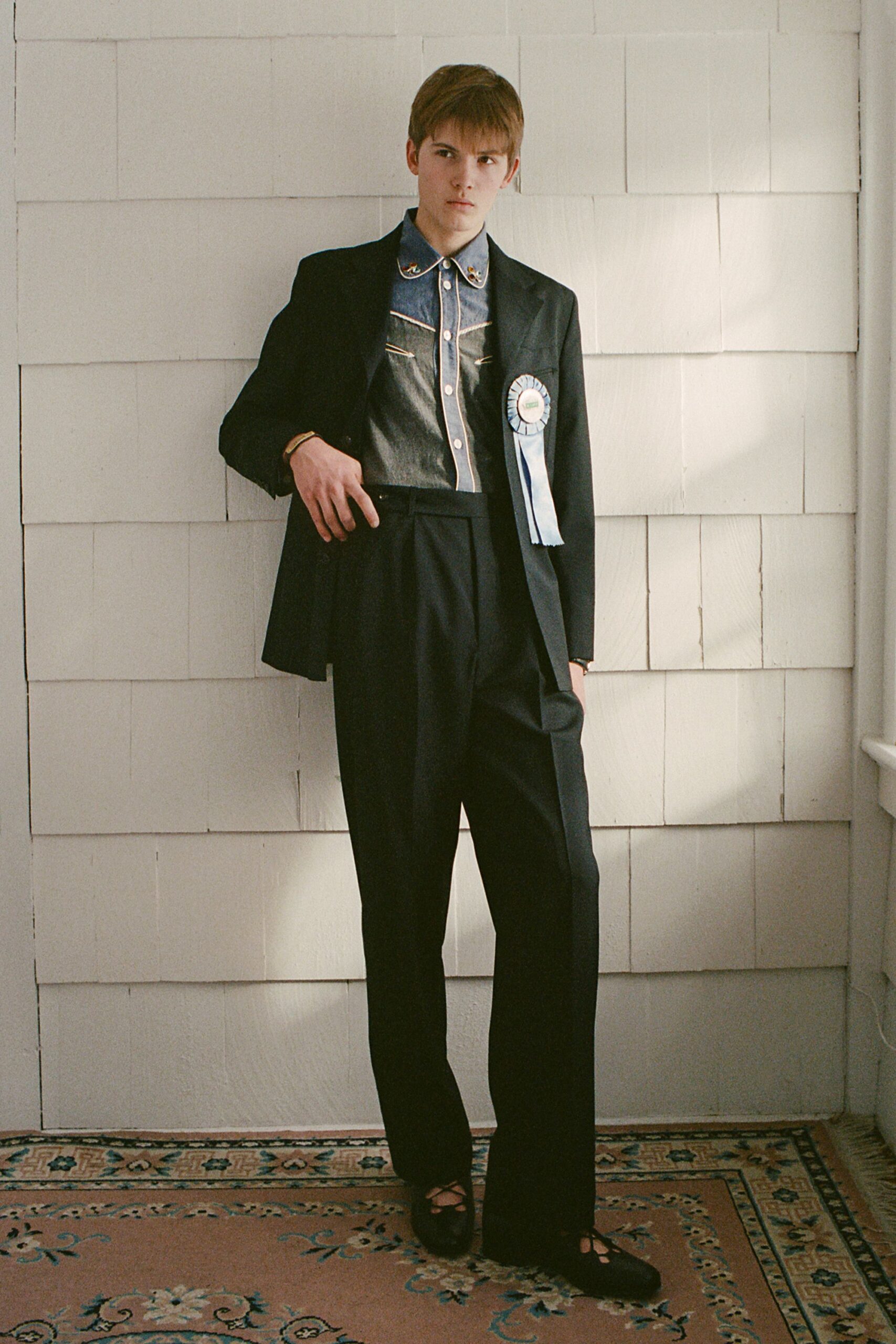 black tailored blazer and blue shirt