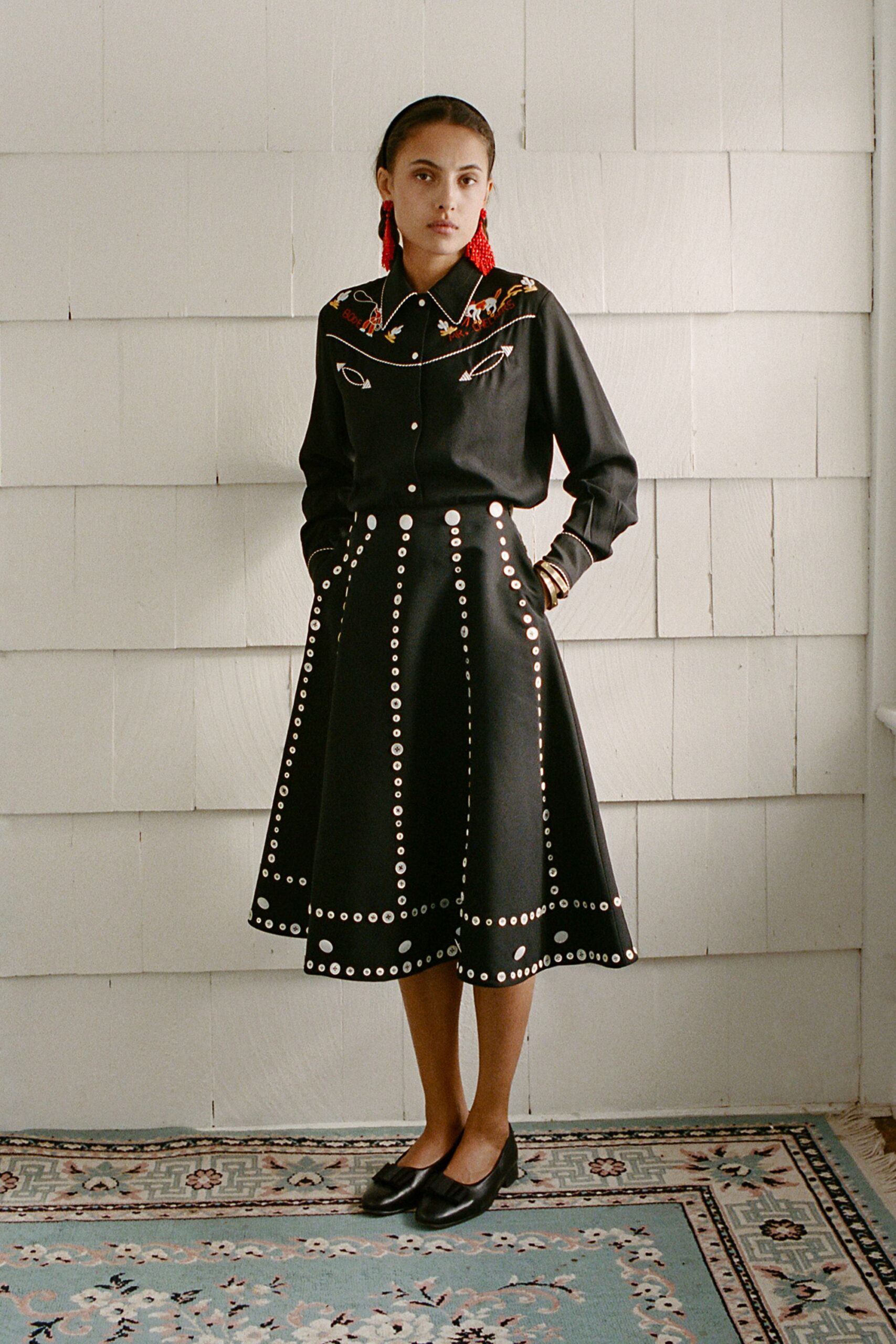black shirt and midi skirt