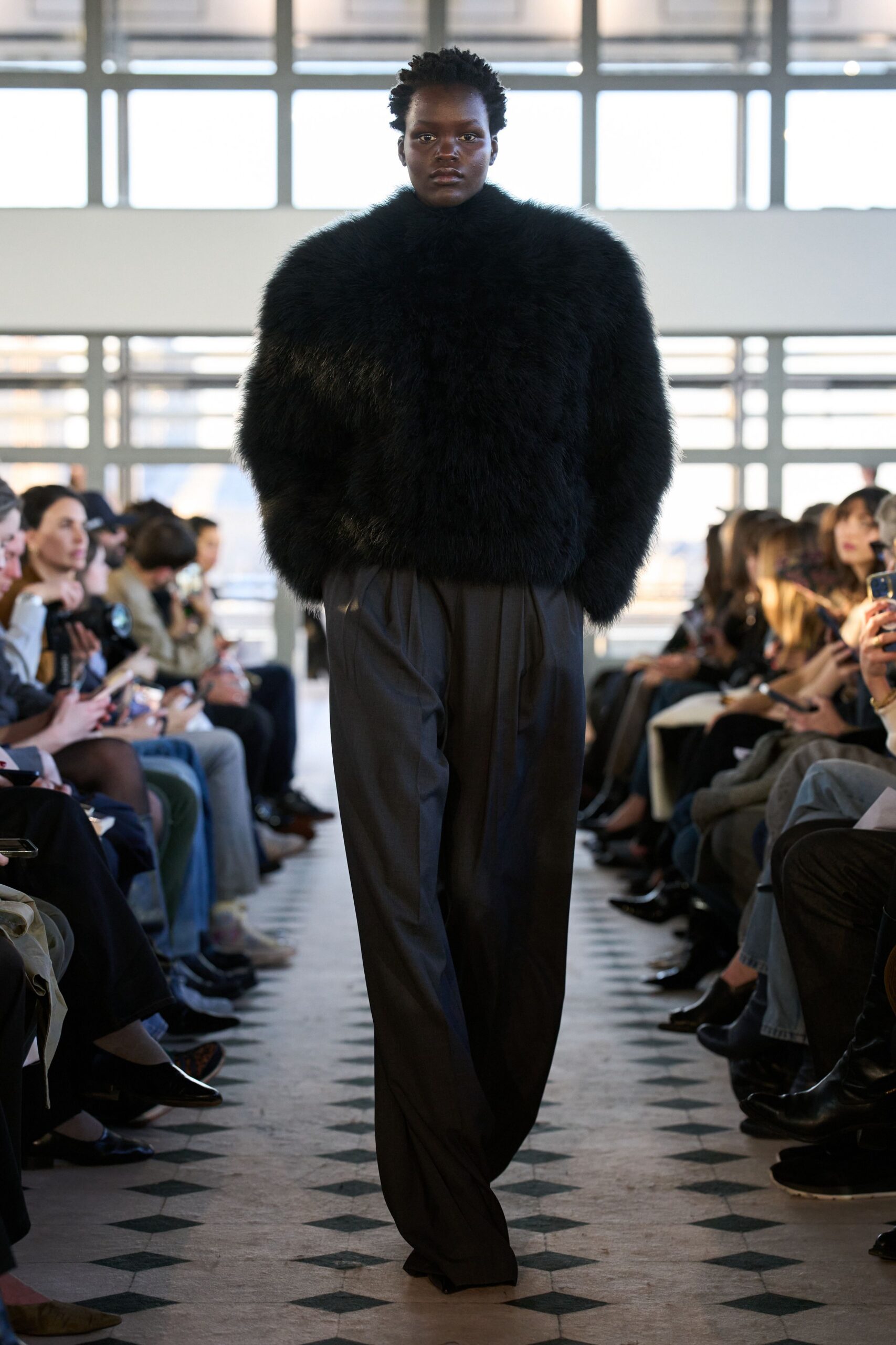 black oversized fur sweater and relaxed pants