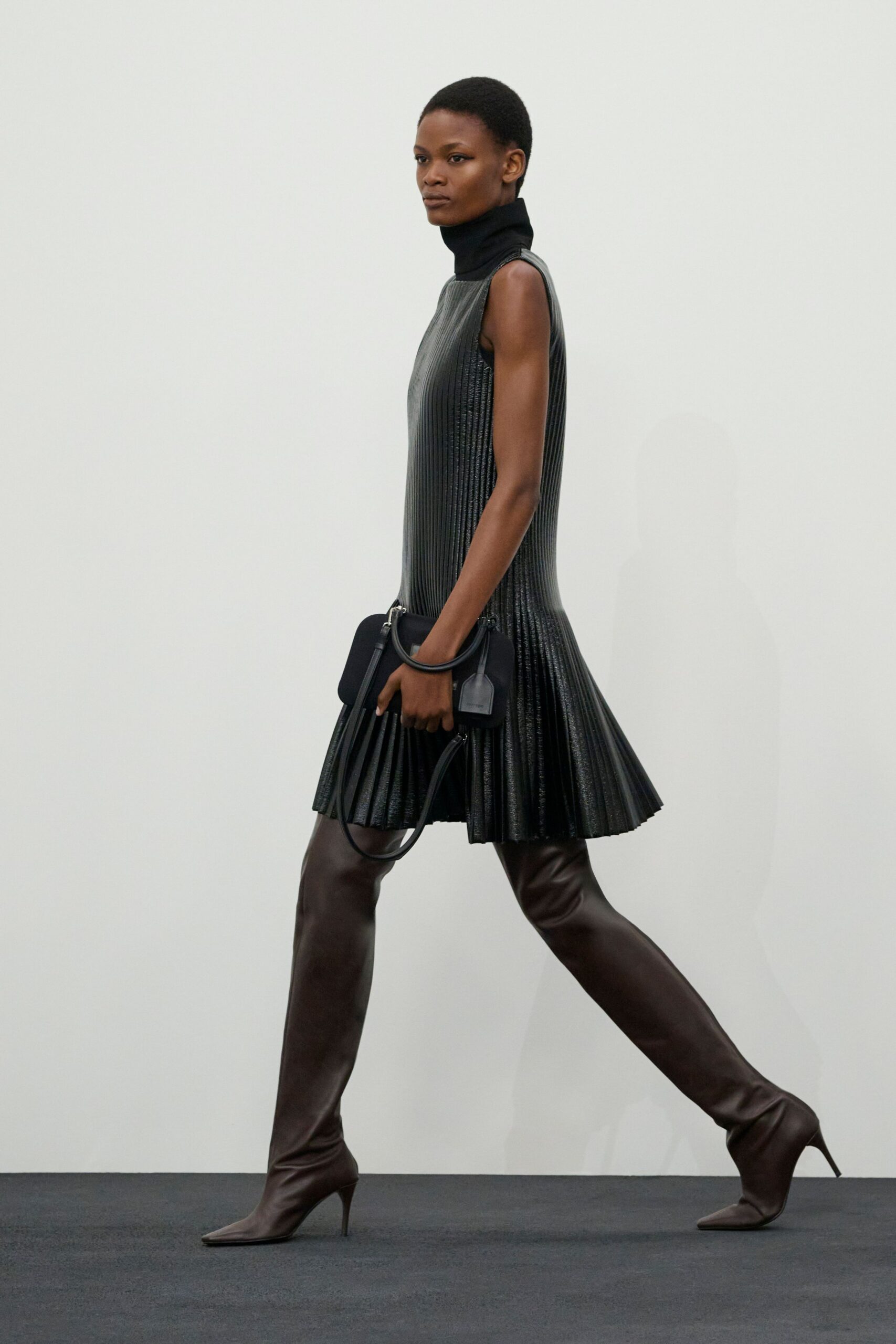black leather sleeveless high-neck fitted pleated mini dress