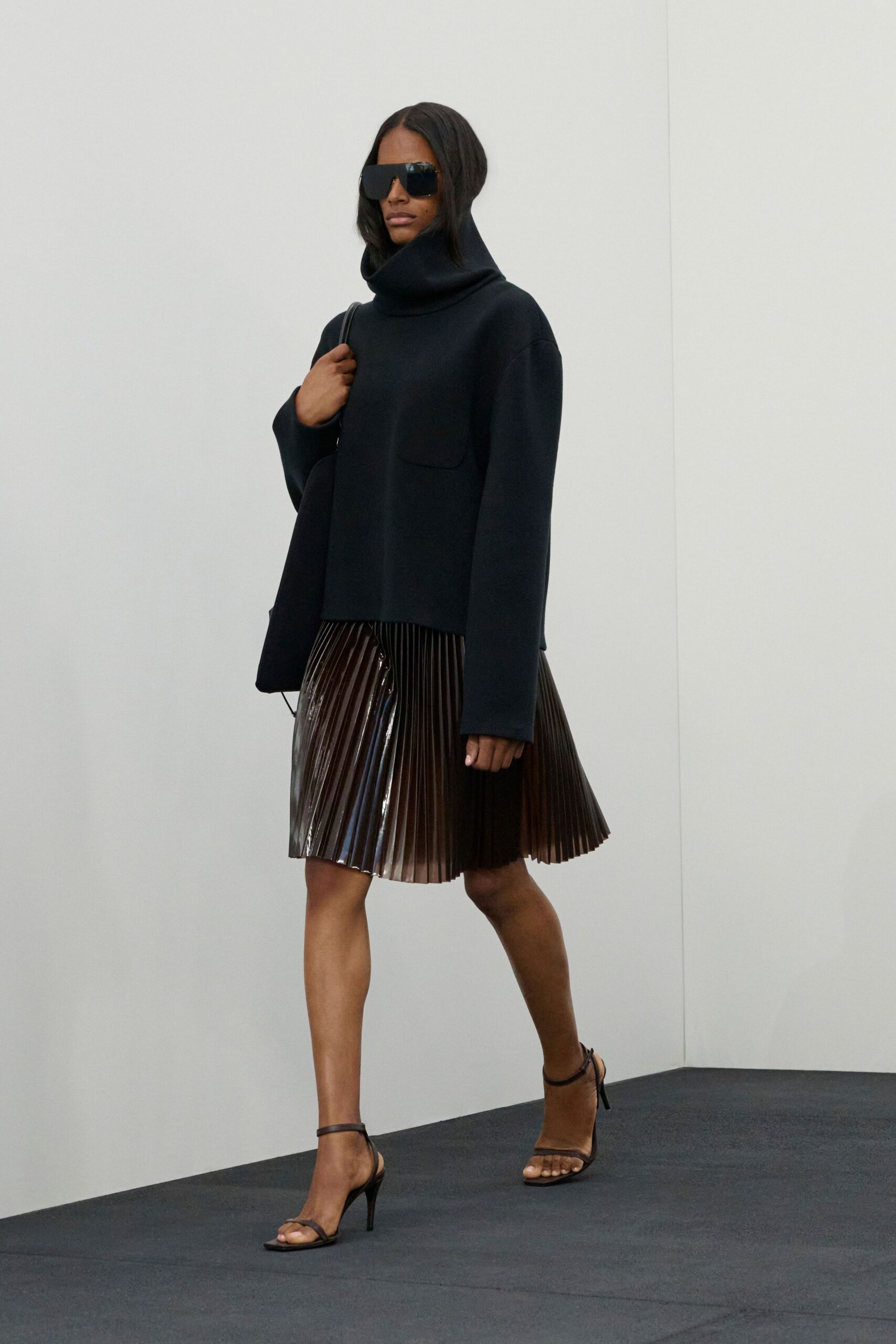 black wool long-sleeve high-neck relaxed pleated top