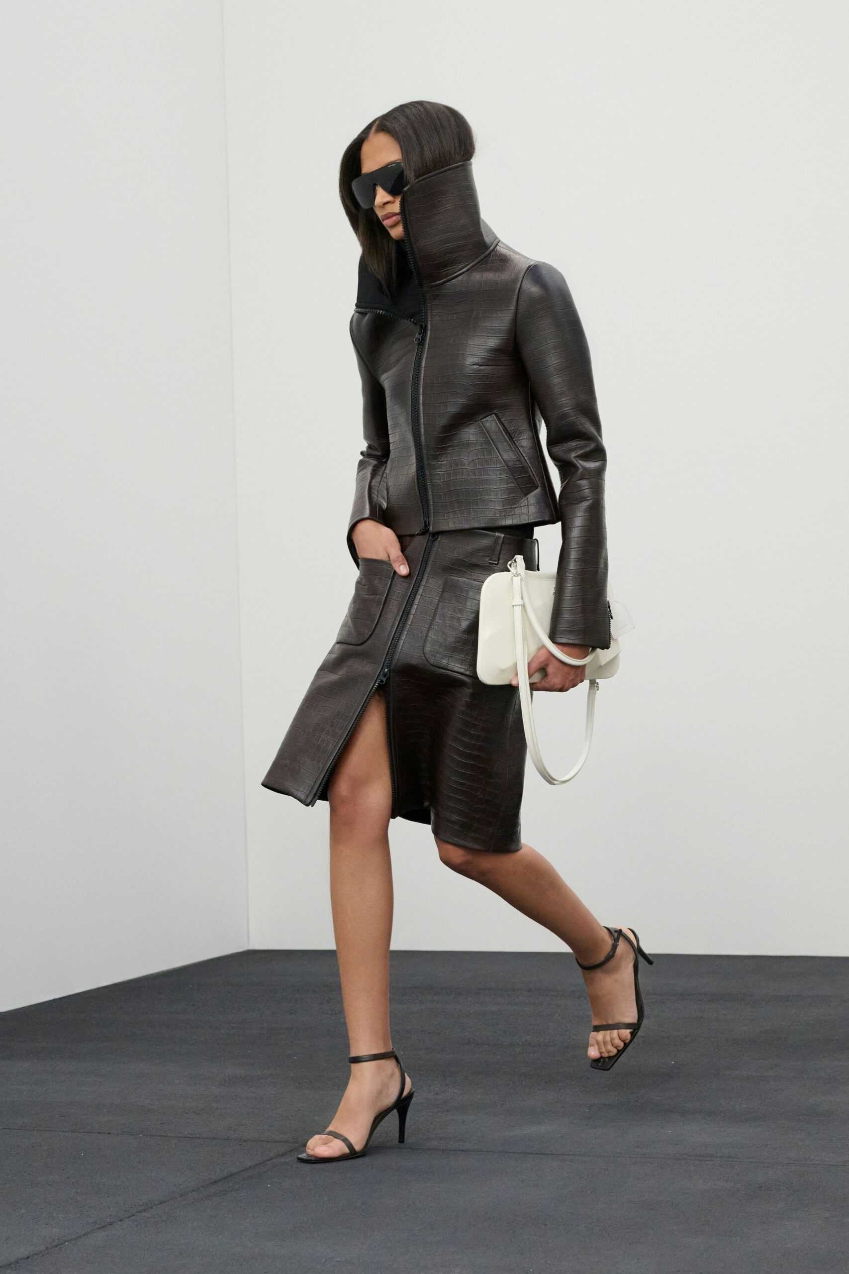 black leather long-sleeve collared fitted zippered textured jacket