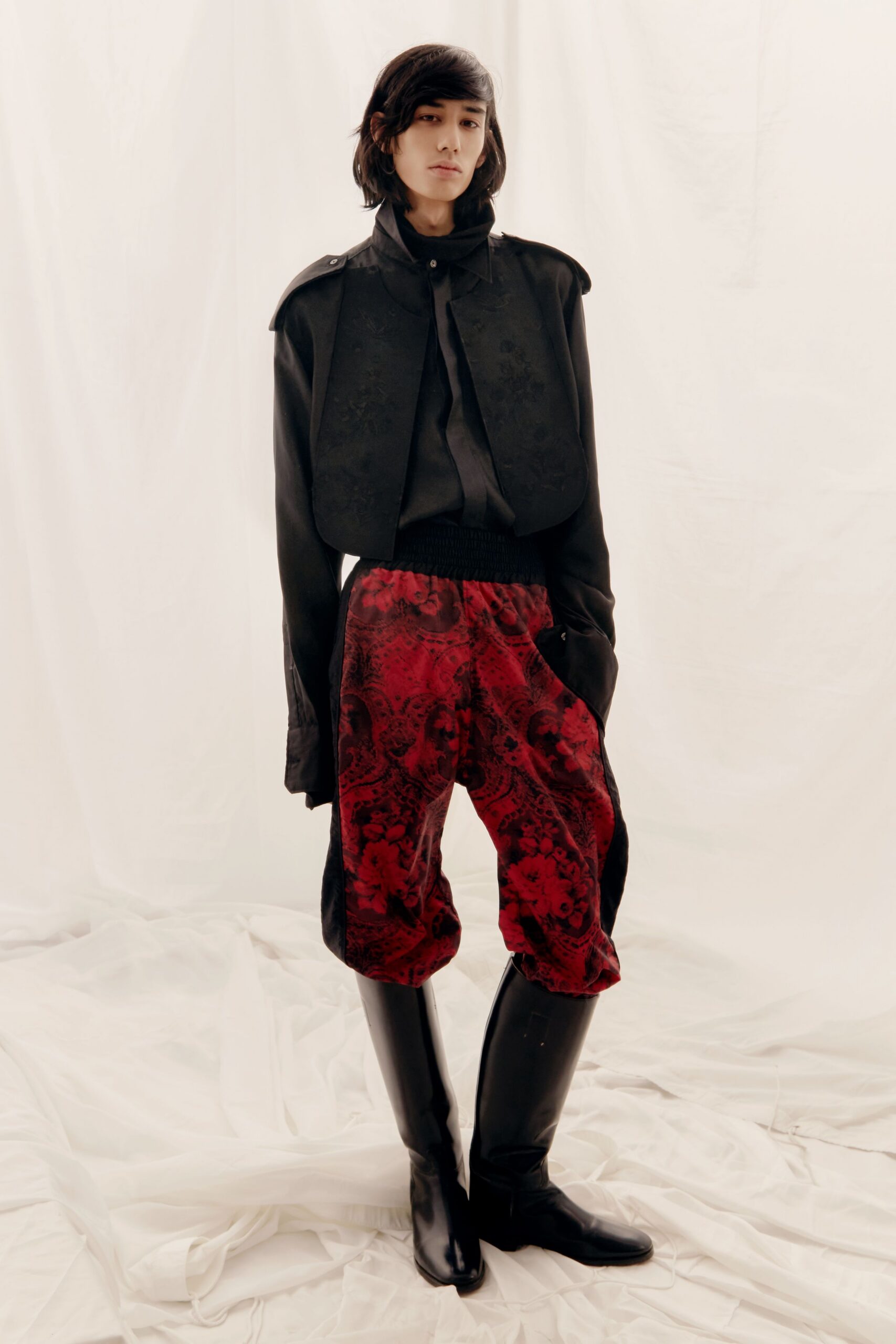 black jacket and red printed pants