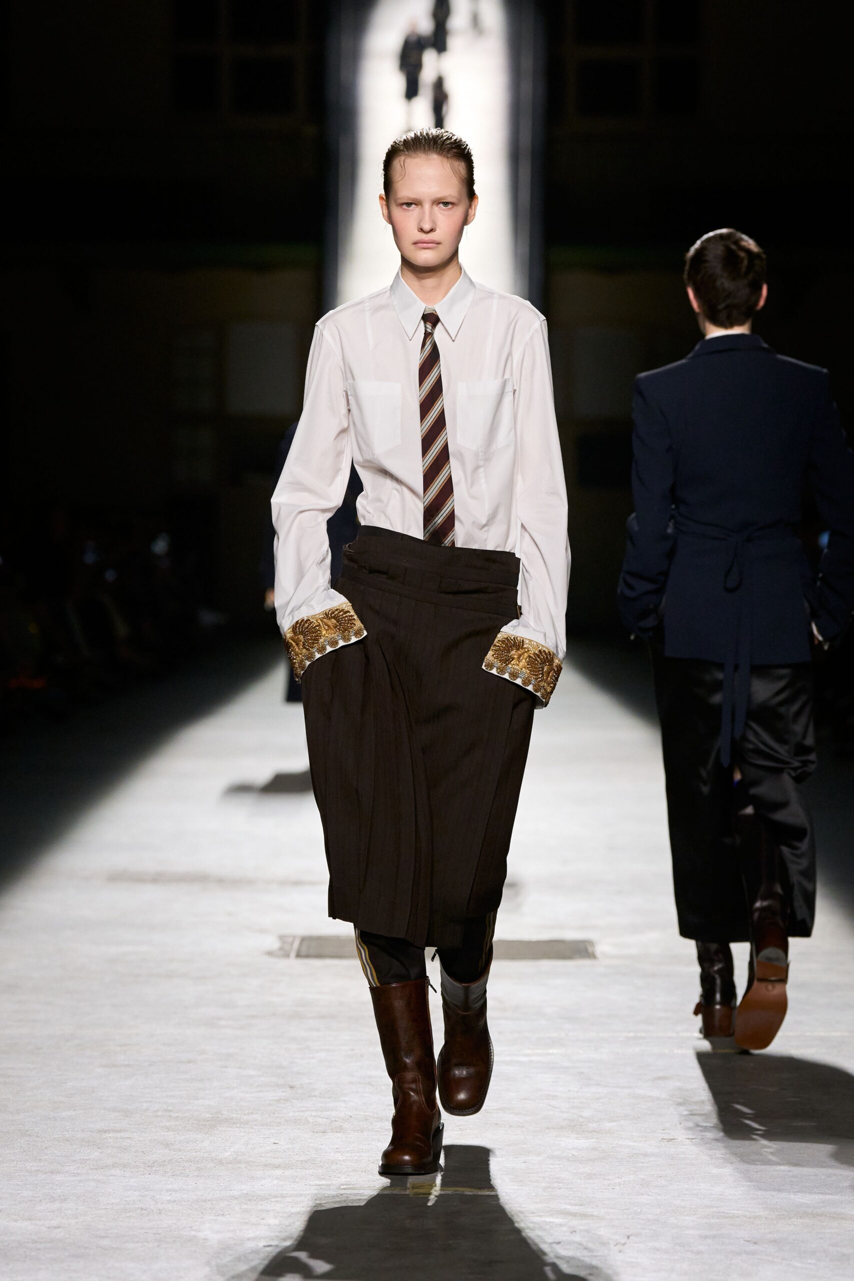white shirt black pants brown boots