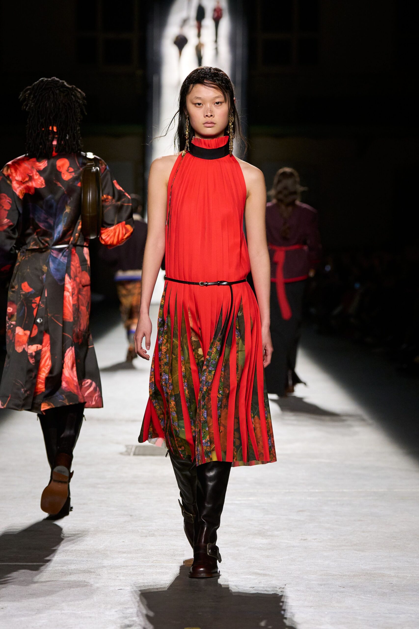 red silk sleeveless high-neck fitted pleated belted dress