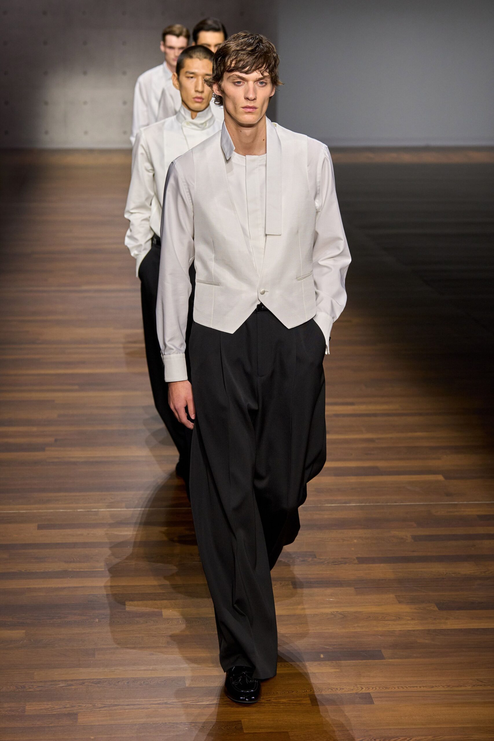 white vest and black pants