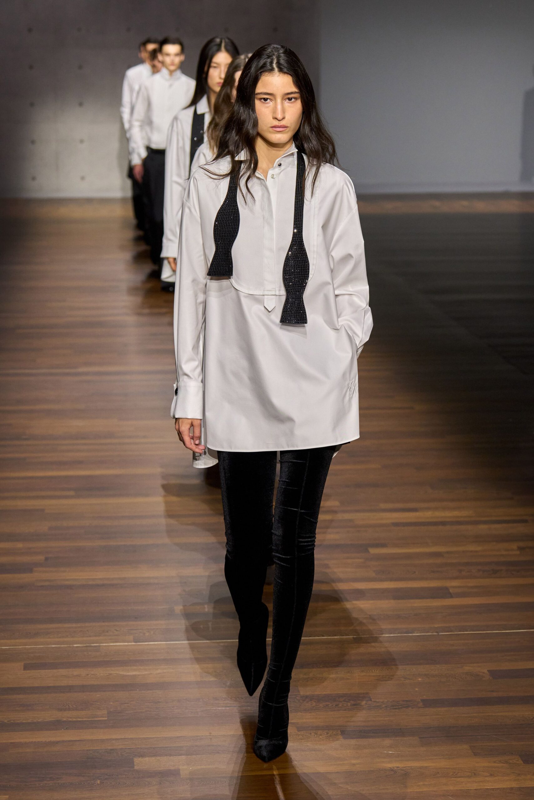 white relaxed shirt with black pants