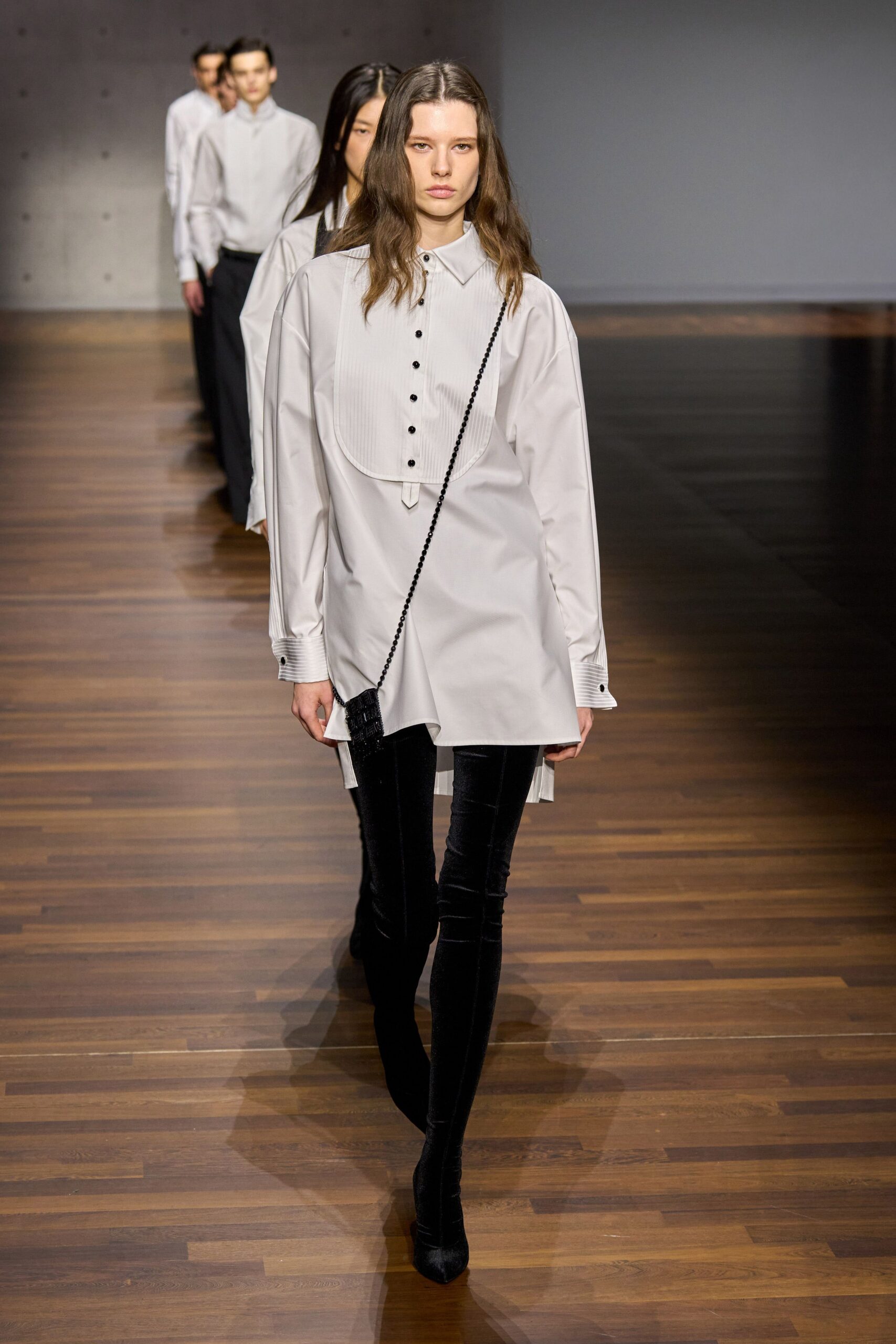white relaxed shirt with black pants