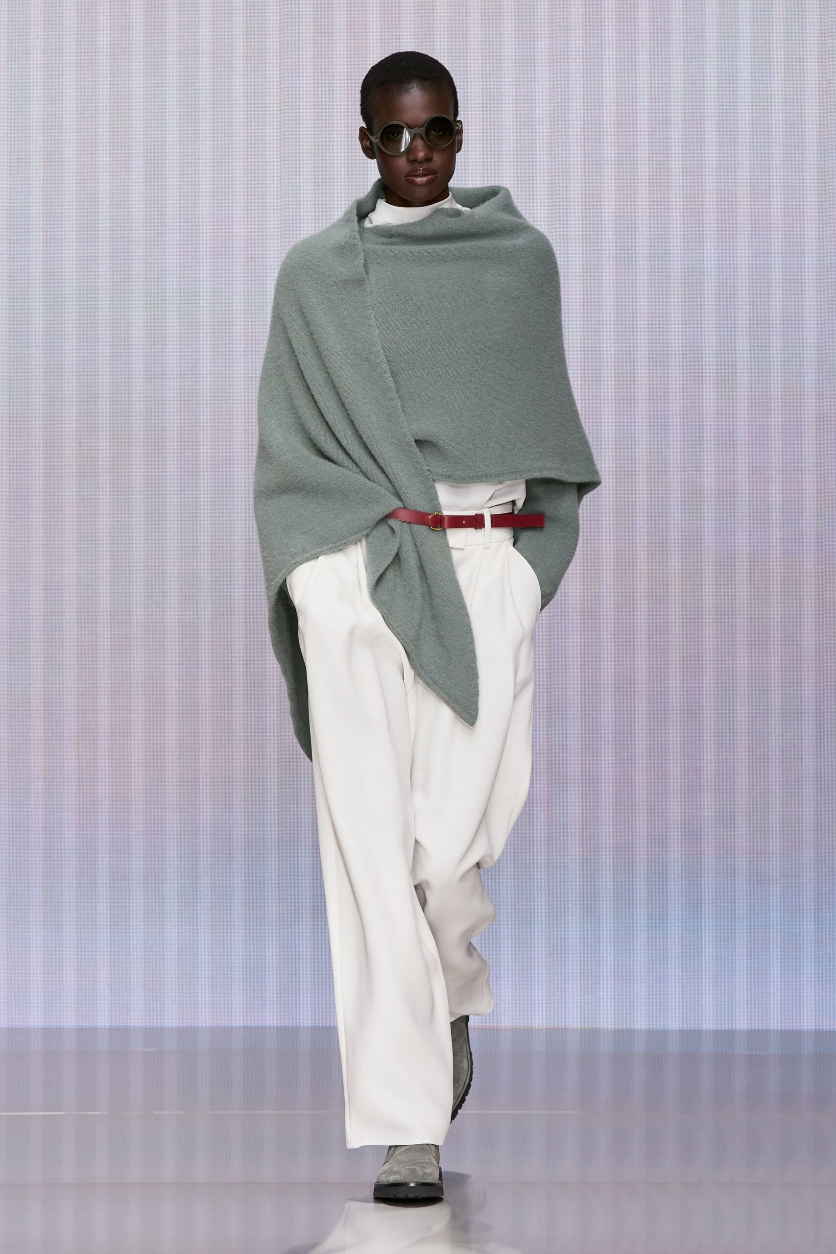 green wool cape with white shirt and tailored pants