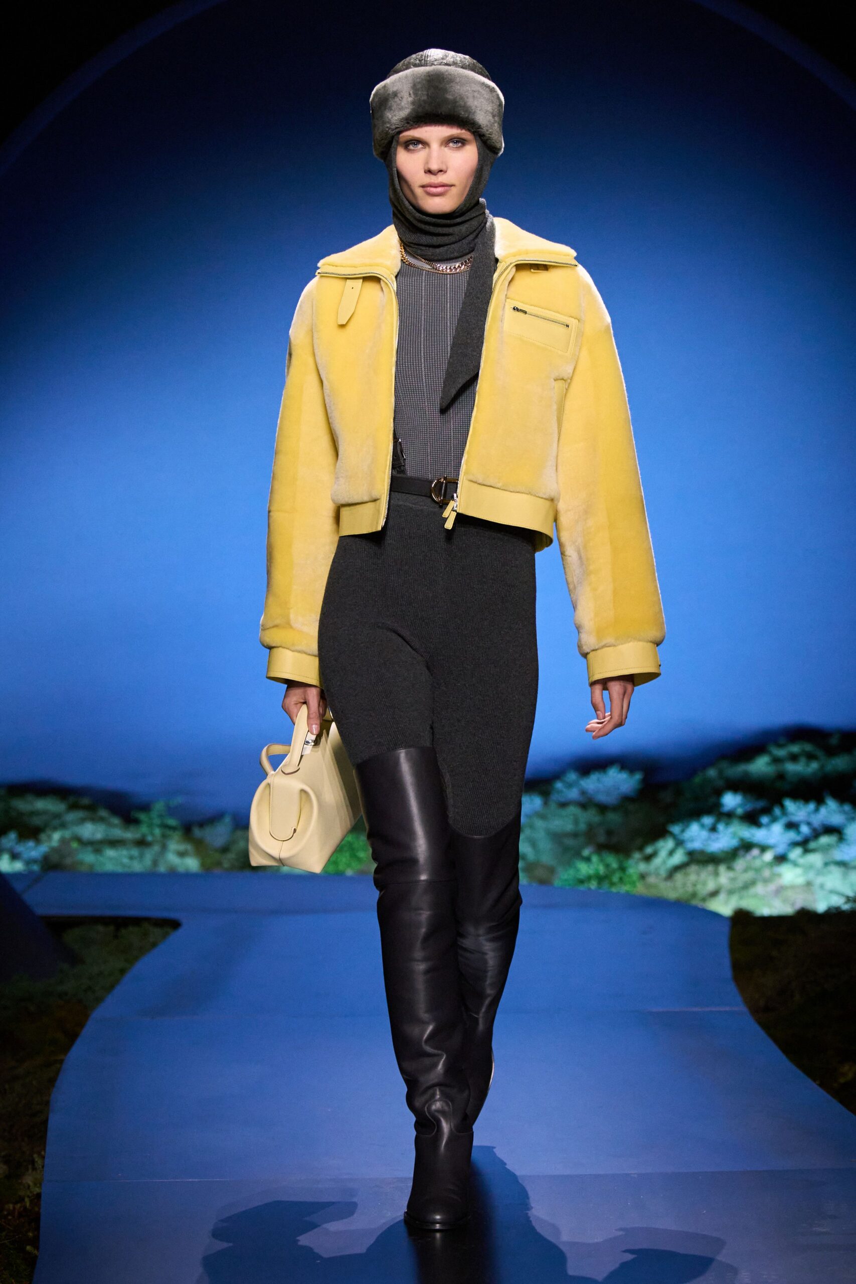 yellow faux-fur jacket gray top black pants