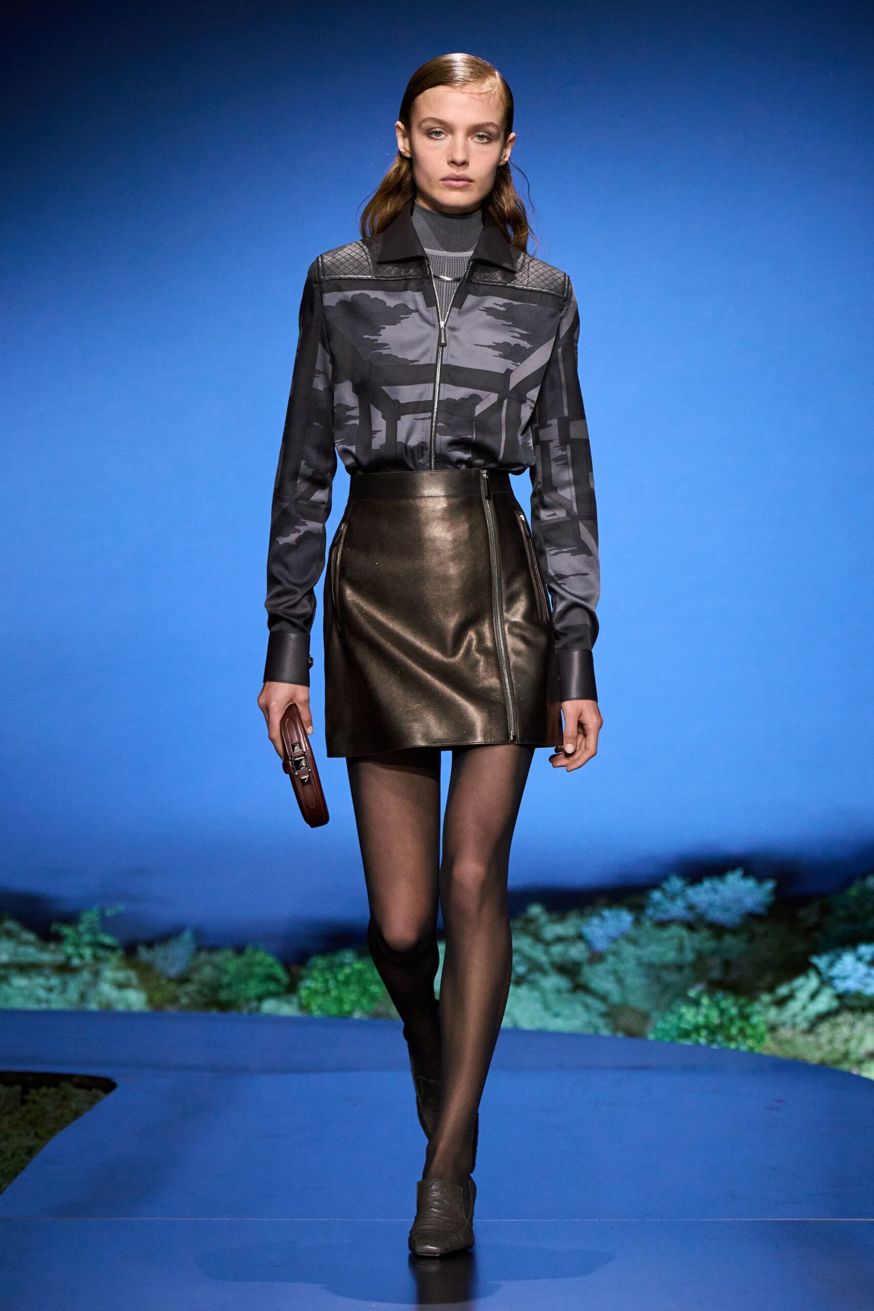 black camouflage shirt and leather skirt