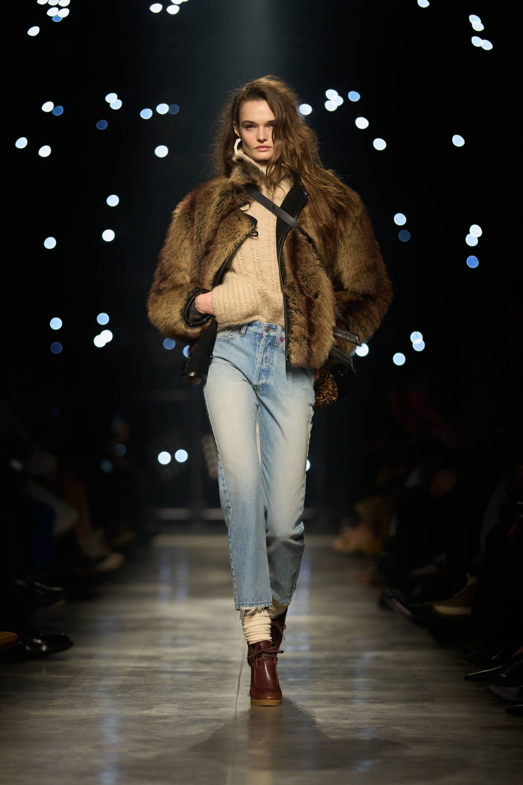 brown fur coat beige sweater blue jeans