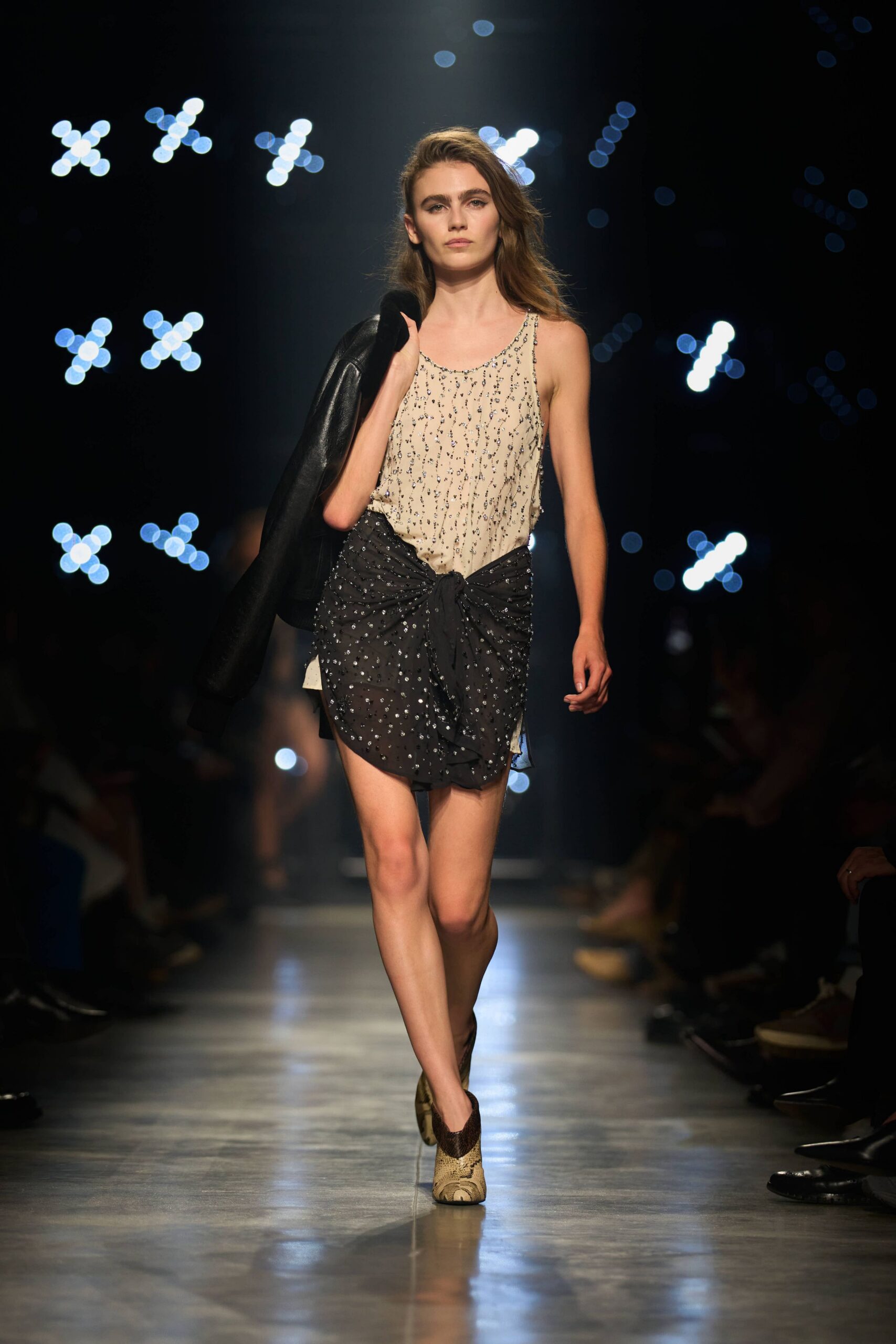 beige embellished top with black skirt