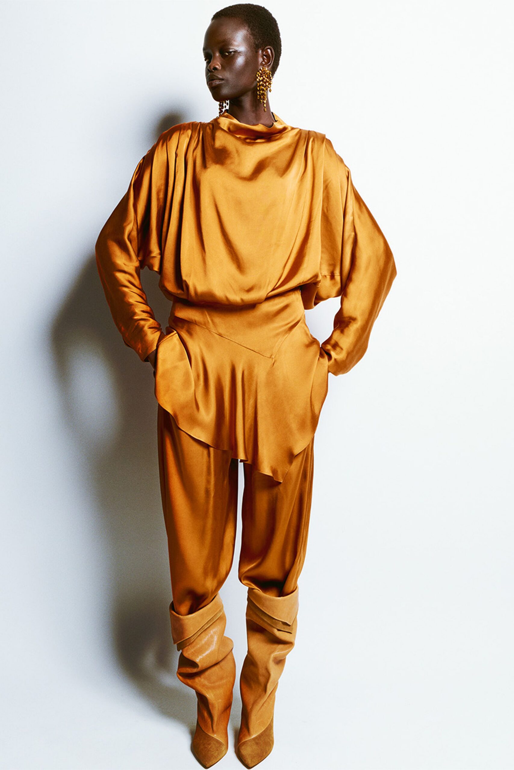 orange silk long-sleeve high-neck relaxed draped pockets jumpsuit