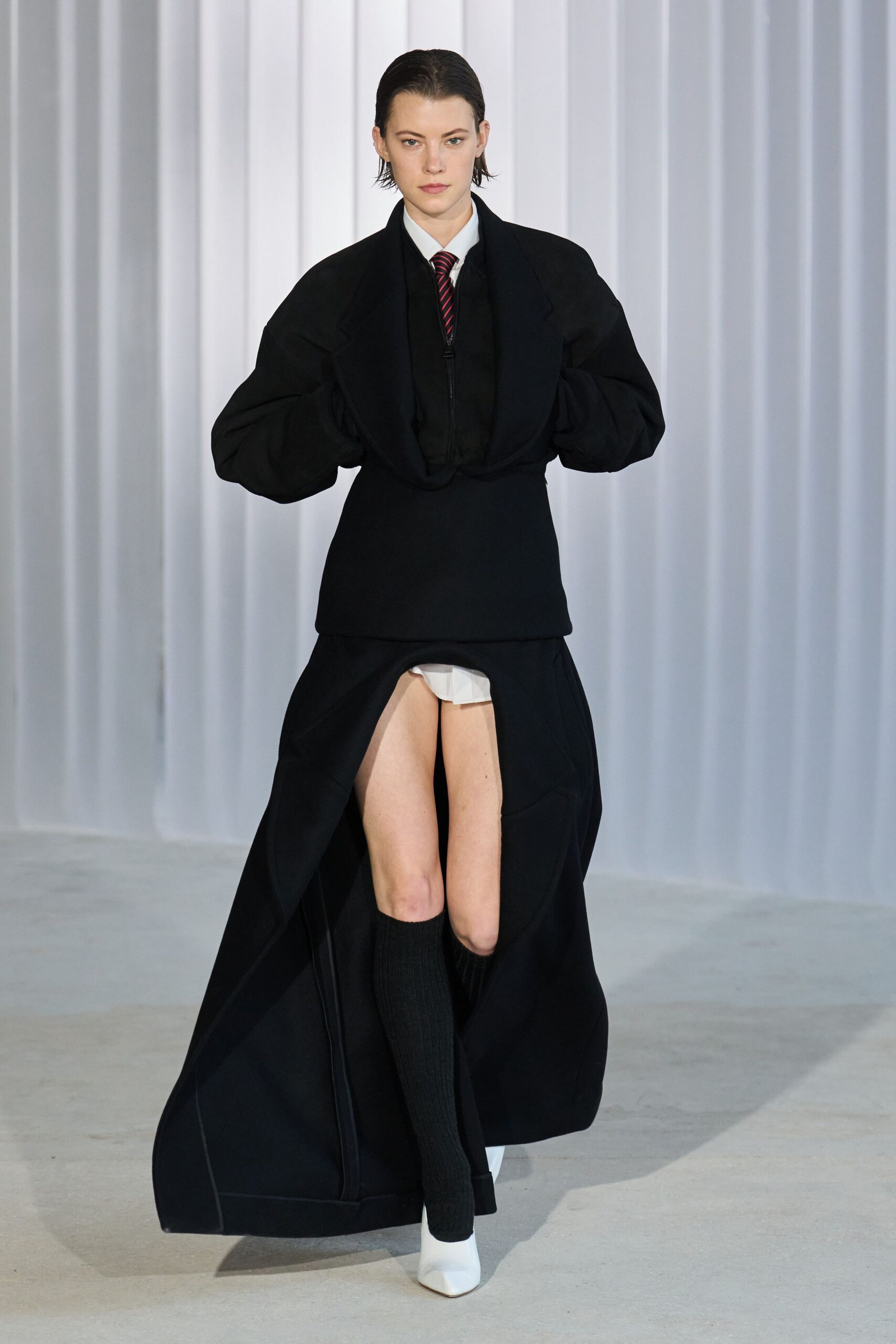 black wool long-sleeve collared structured buttoned coat