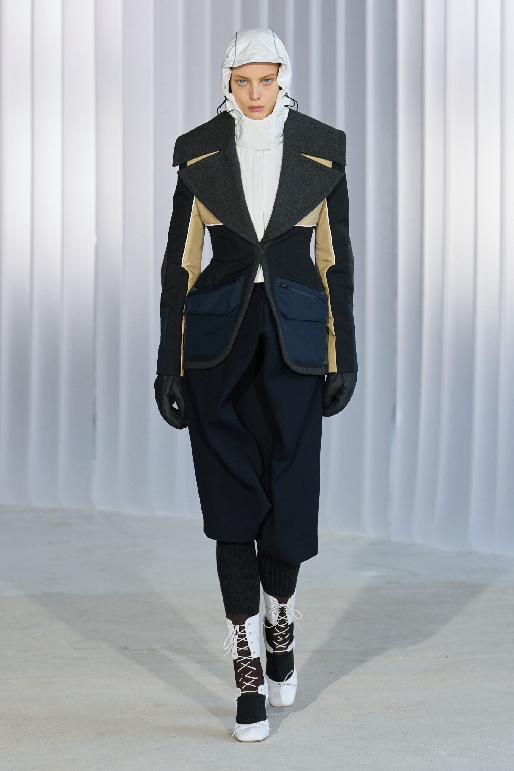 structured black blazer with pleated pants