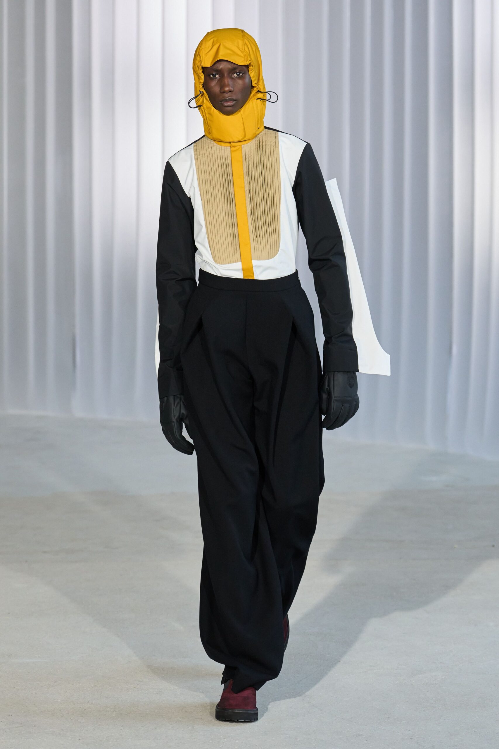 black and white shirt with yellow hat