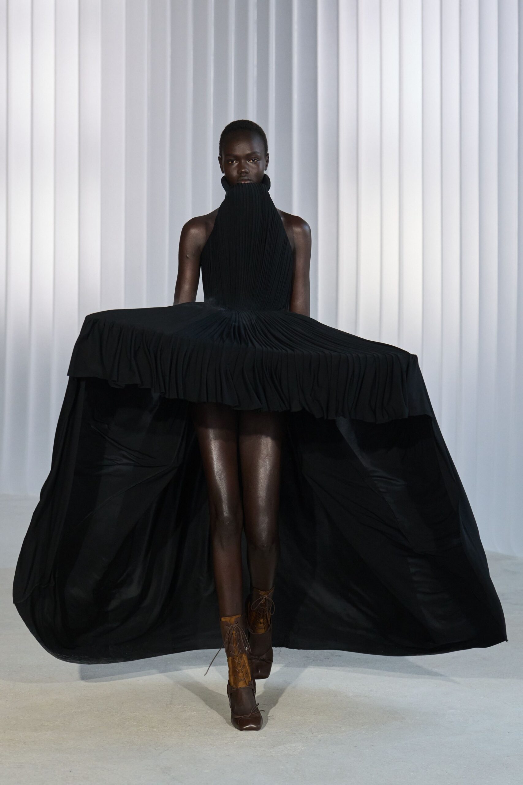 black silk sleeveless high-neck fitted pleated a-line dress