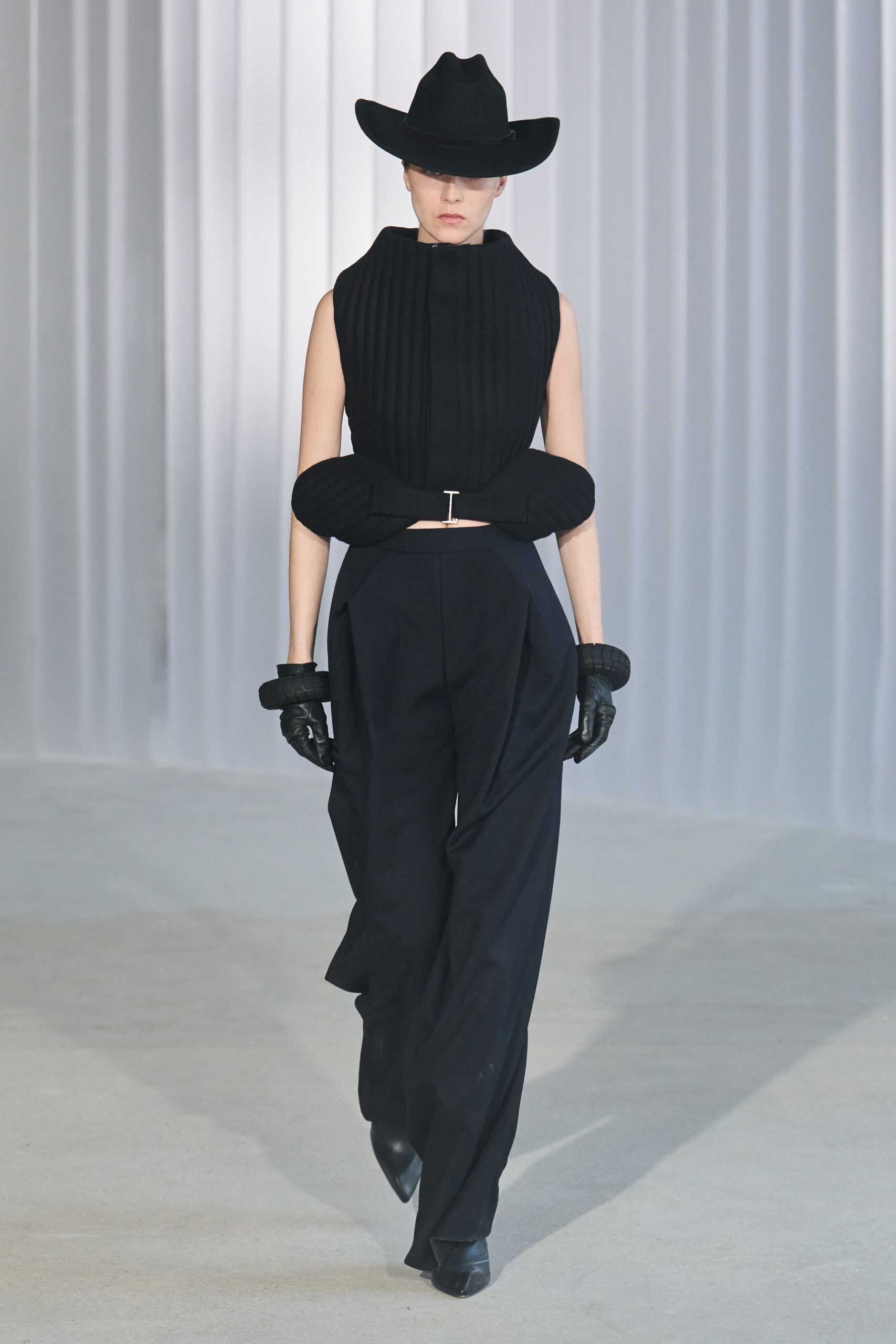 black fitted top and relaxed pants