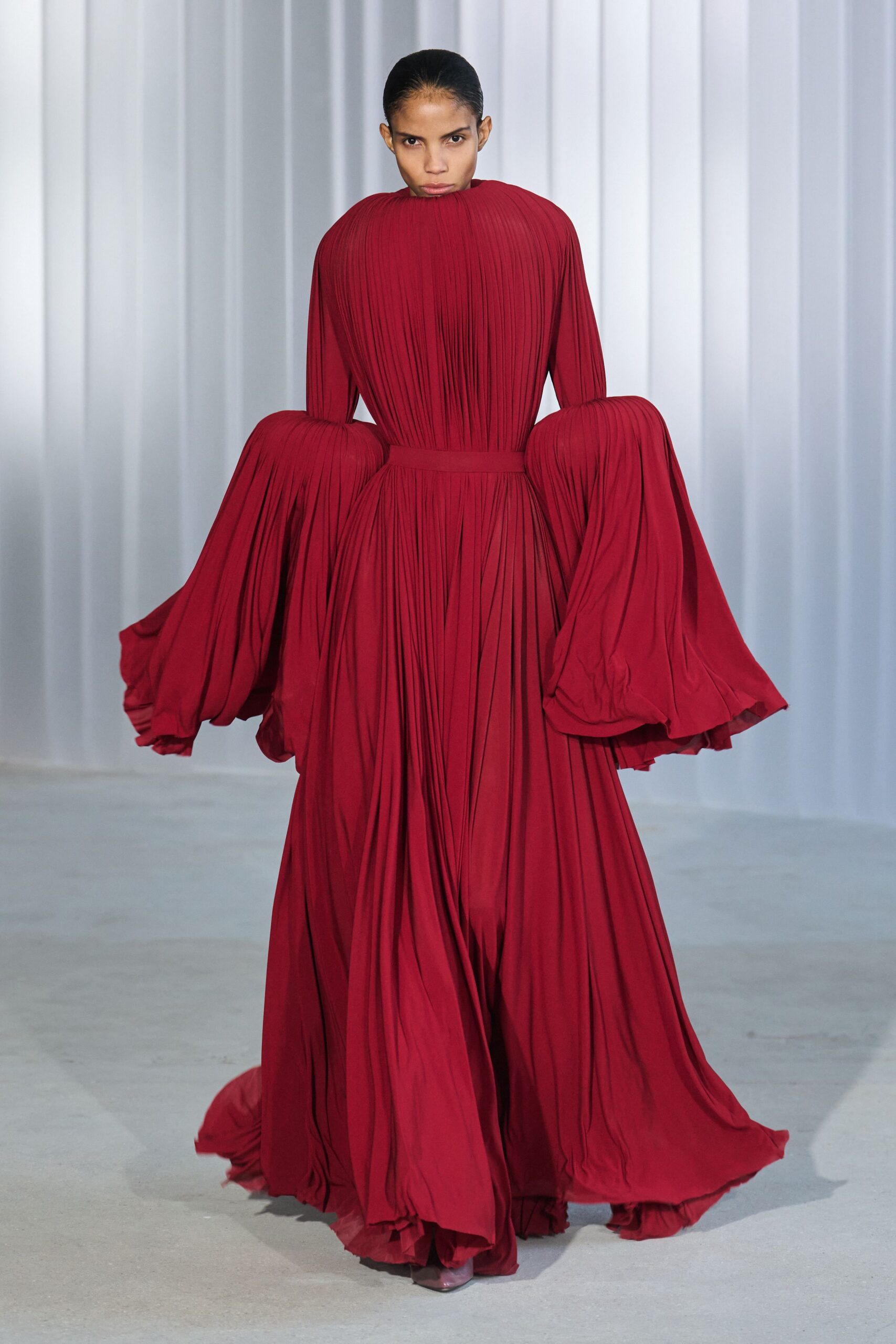 red silk pleated gown