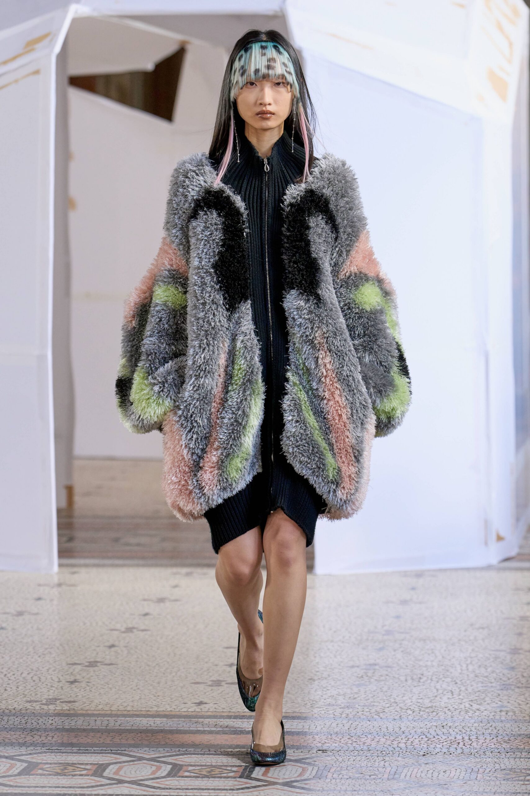 oversized faux-fur coat with black dress