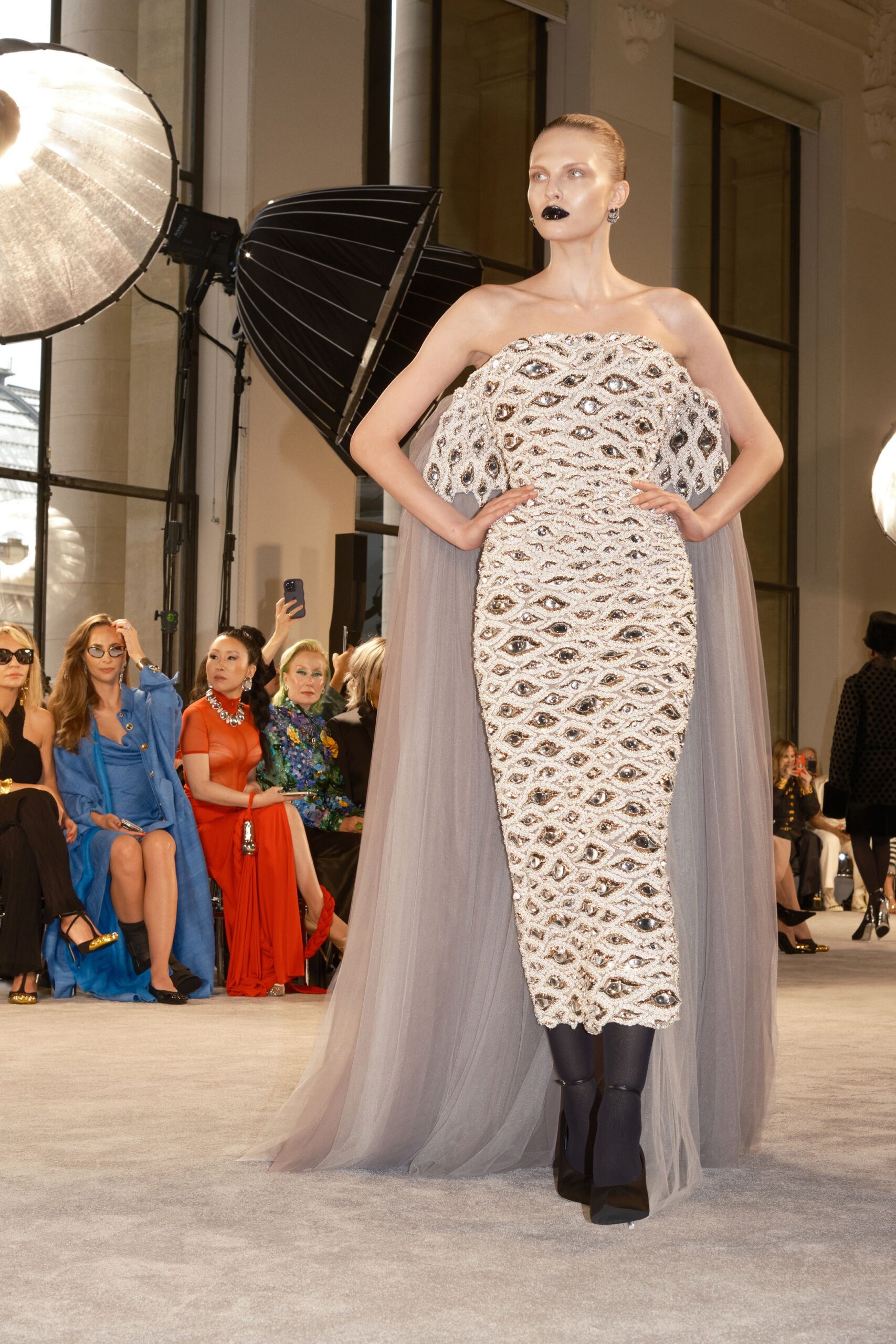 white beaded strapless gown with gray cape