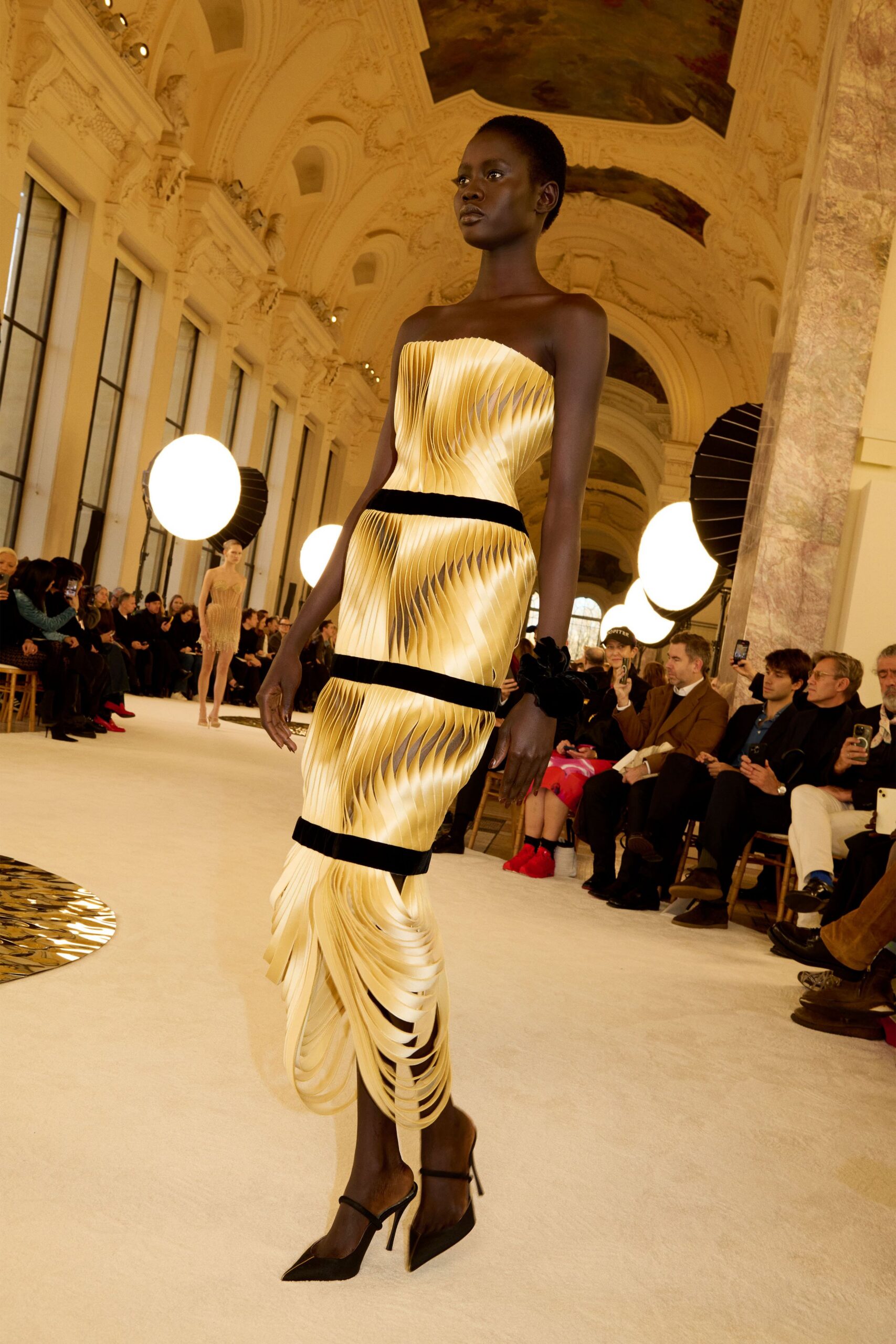 gold silk strapless fitted pleated draped shiny dress