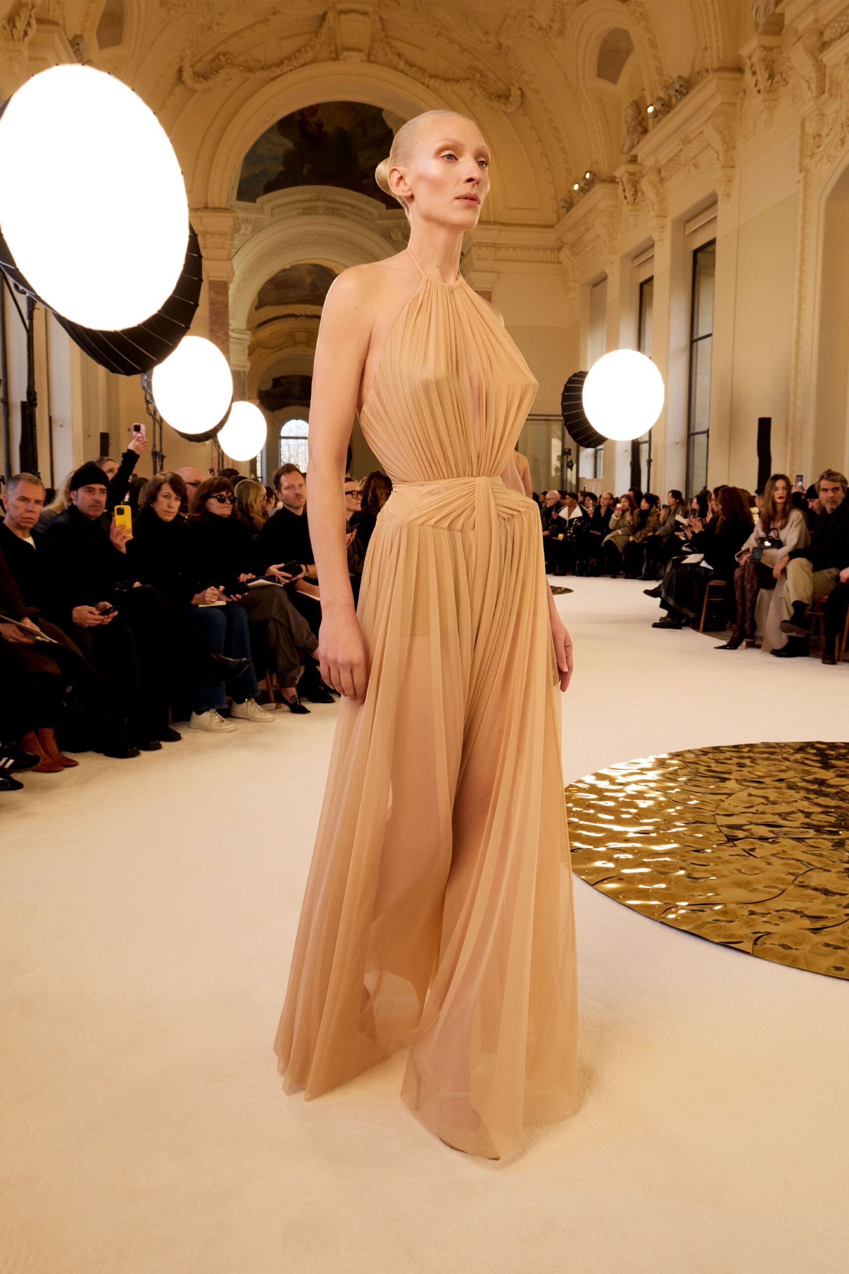 beige pleated sleeveless gown