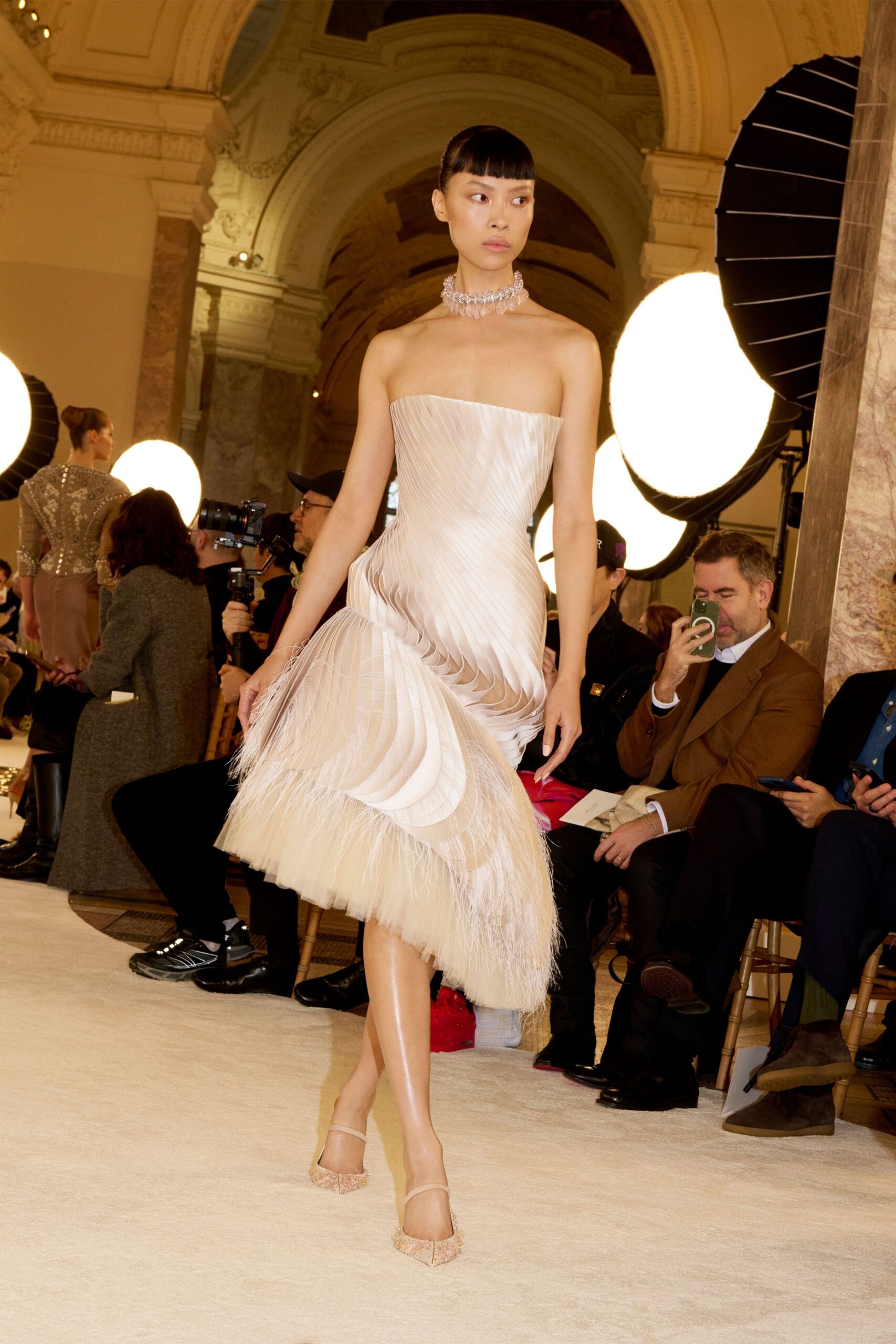 beige silk strapless fitted pleated layered flowing gown