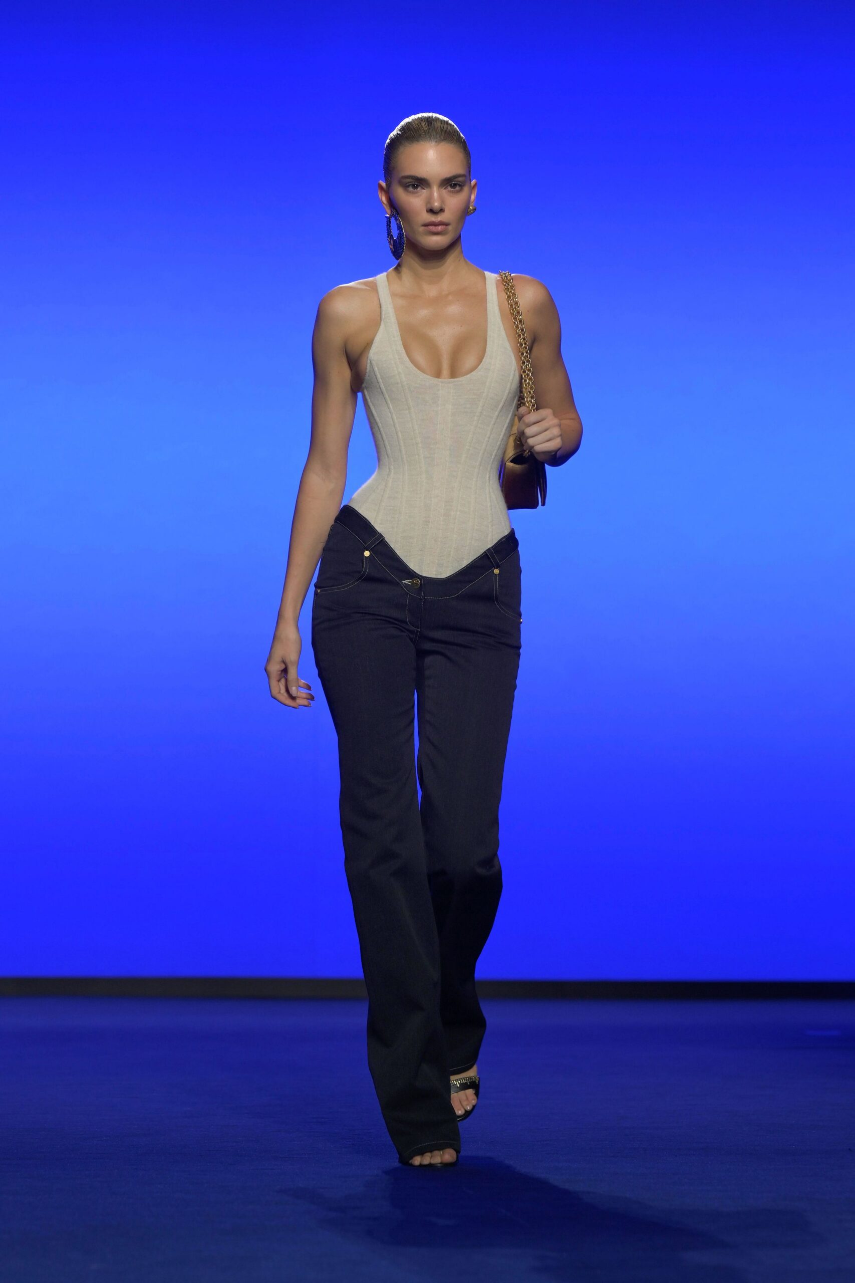 beige bodysuit black flared pants
