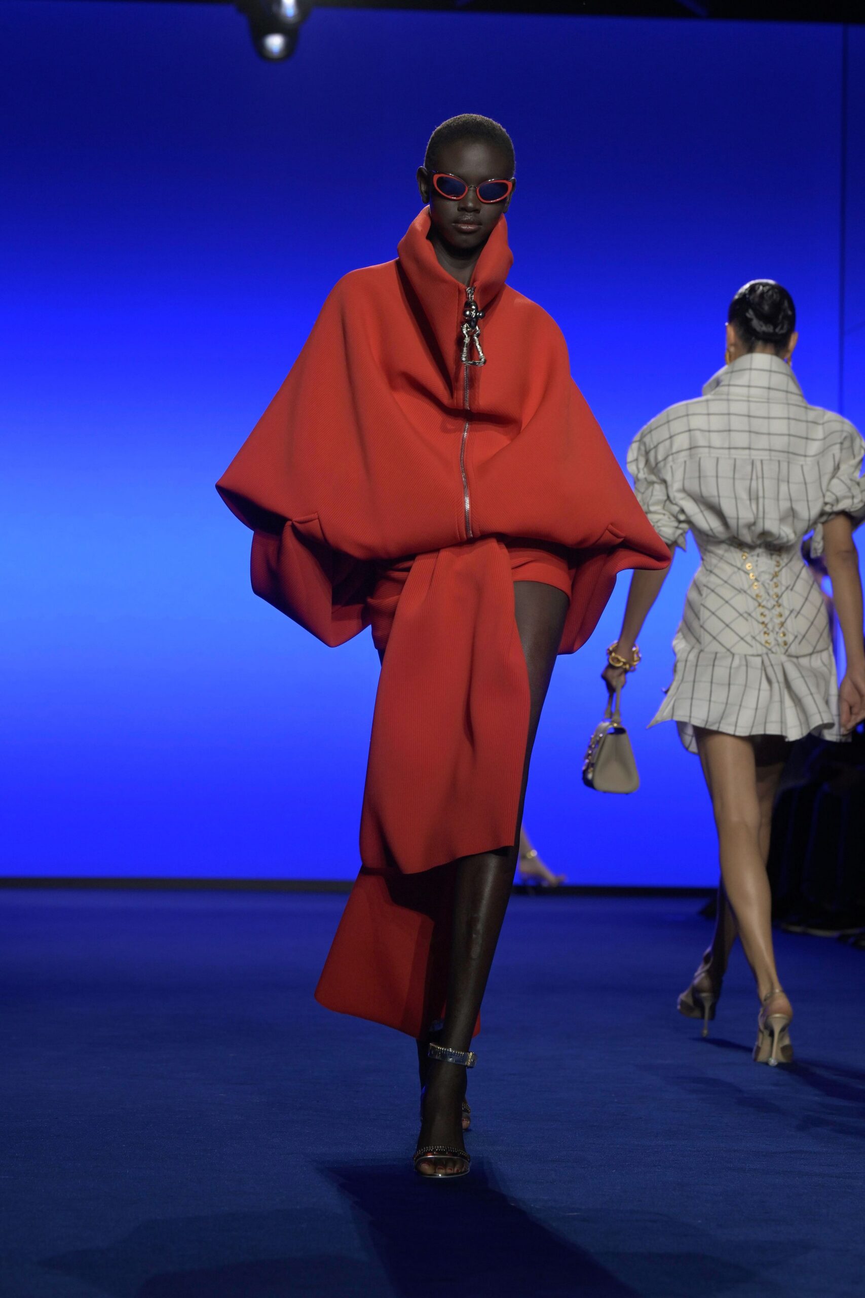 oversized red coat and fitted gray dress