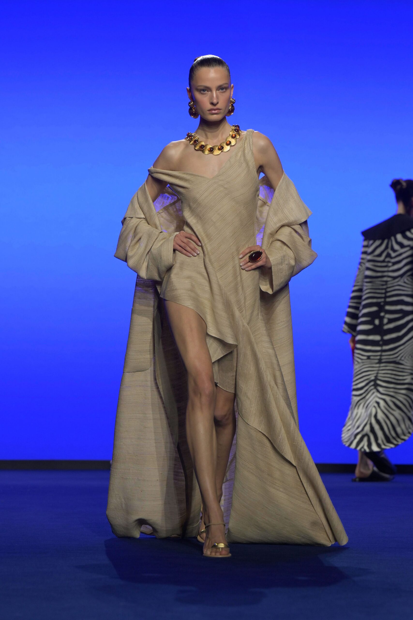 beige silk gown with cape