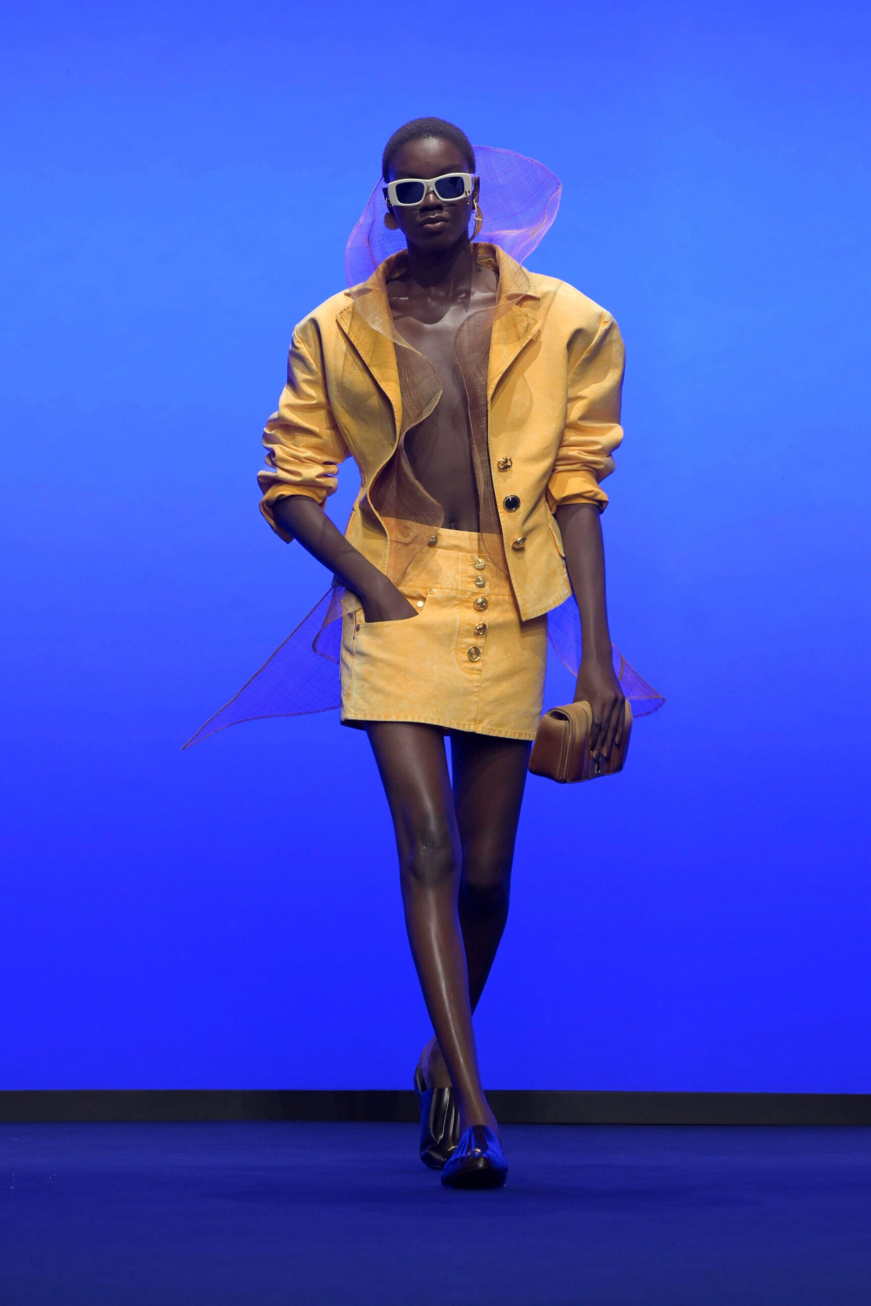 yellow fitted jacket and mini skirt