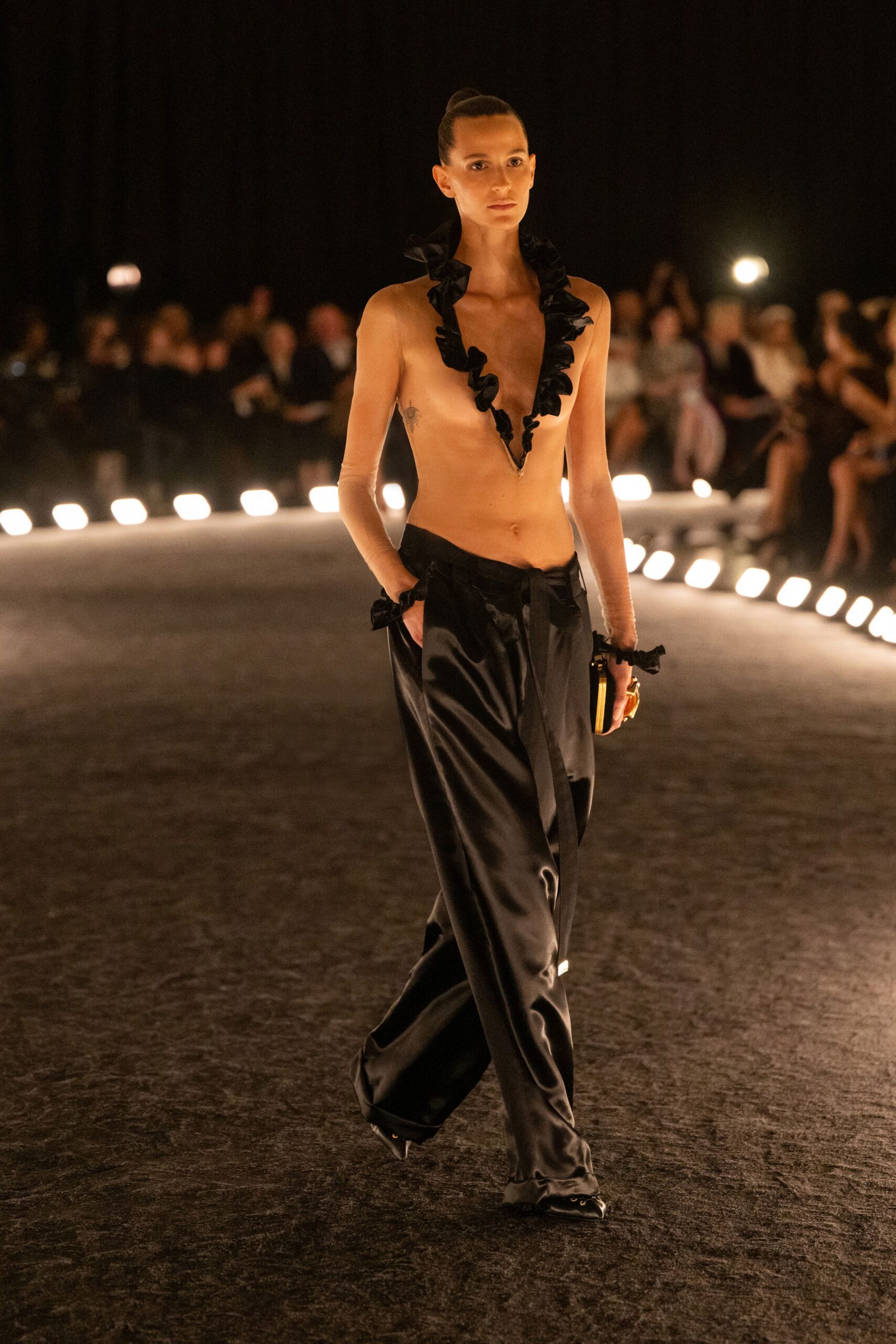 black ruffled top with wide-leg pants