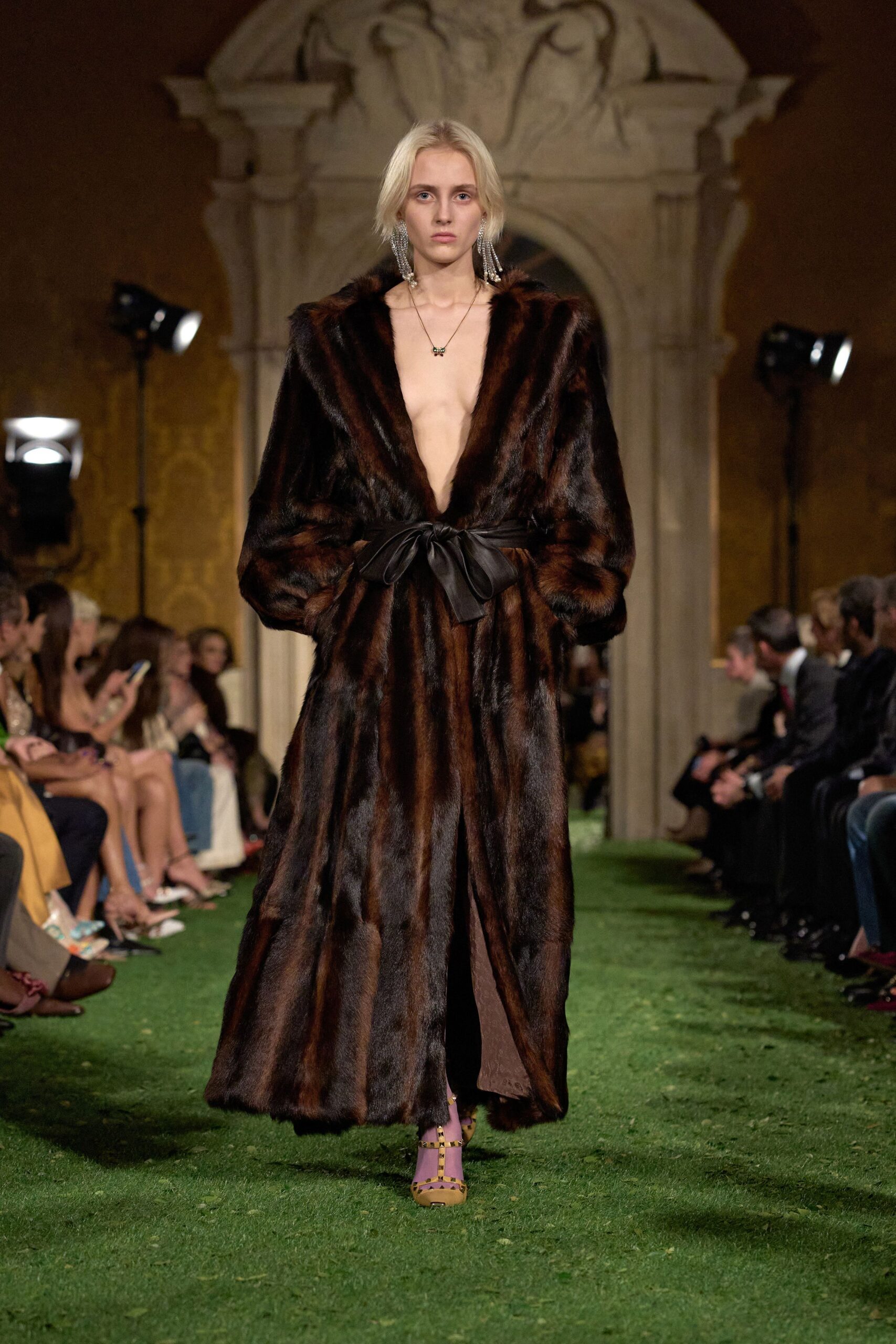 brown fur belted coat with purple shoes