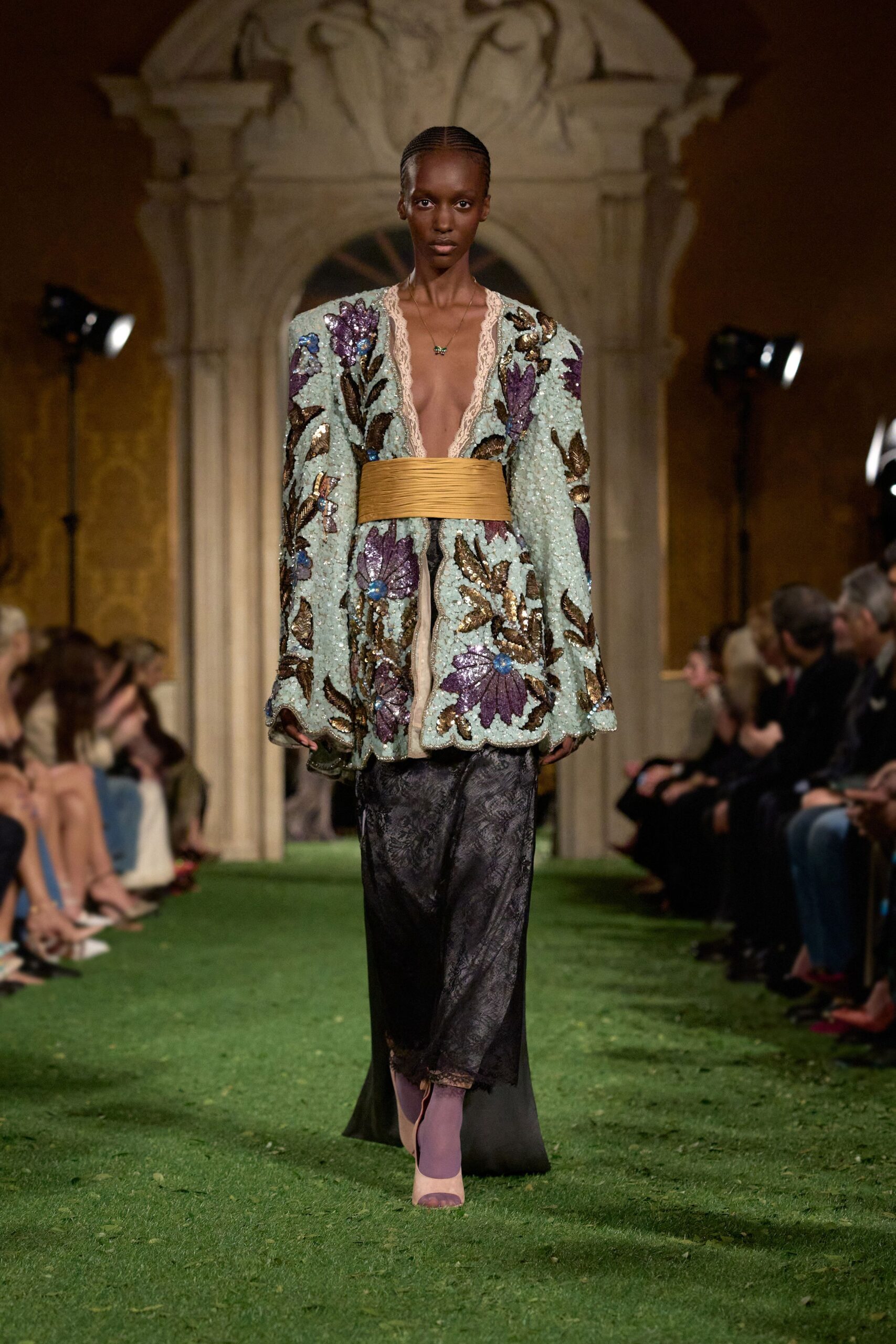 embroidered blue jacket with gold belt