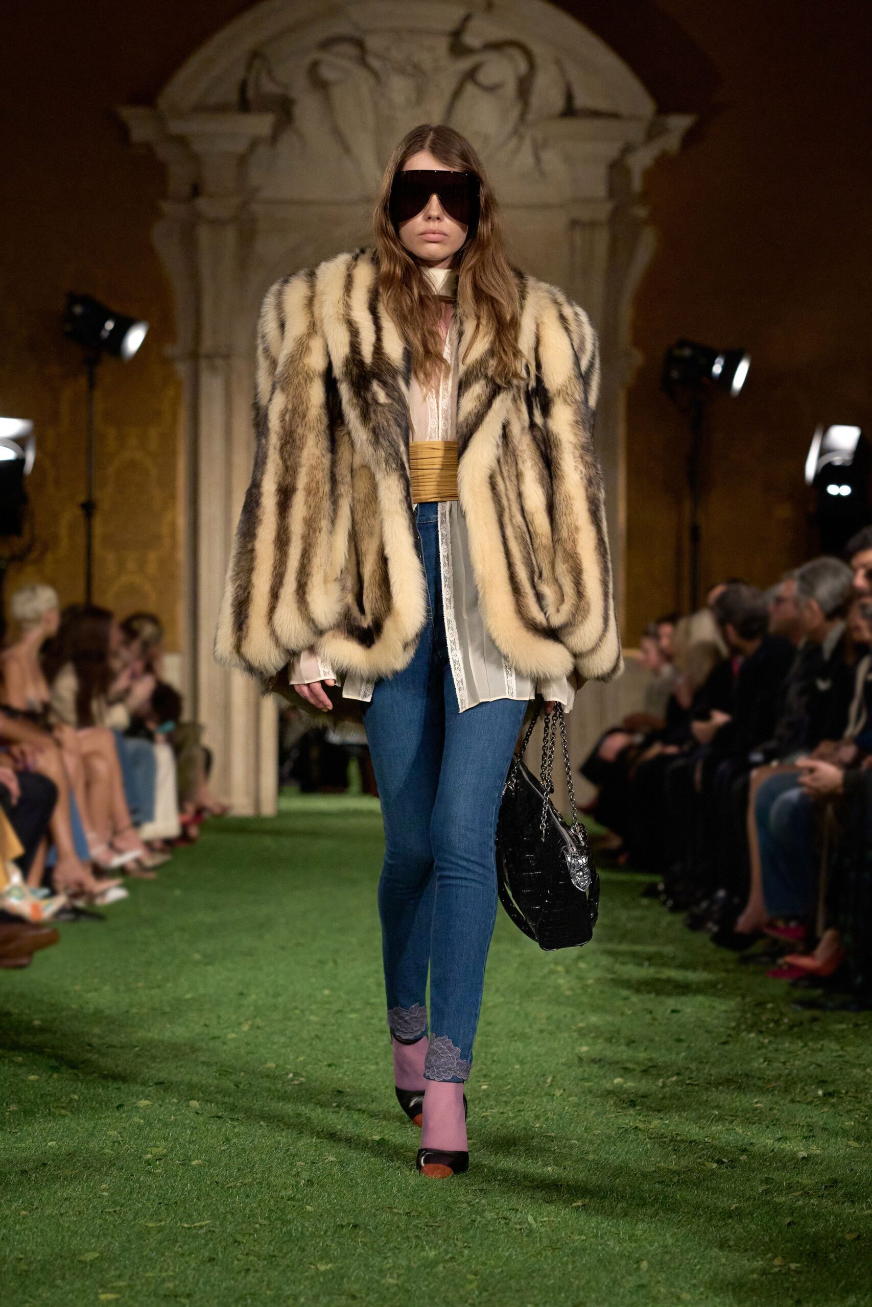 oversized fur coat with denim pants