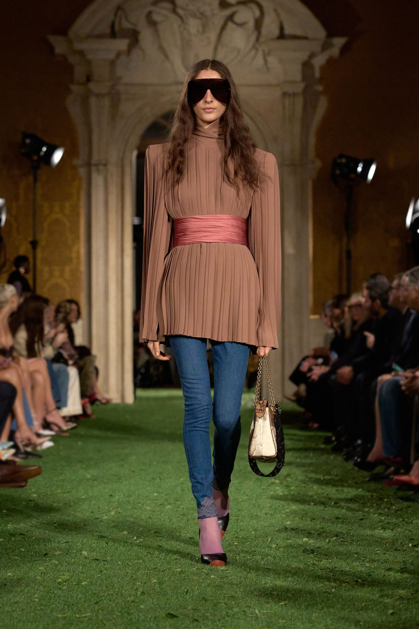 beige pleated top with jeans