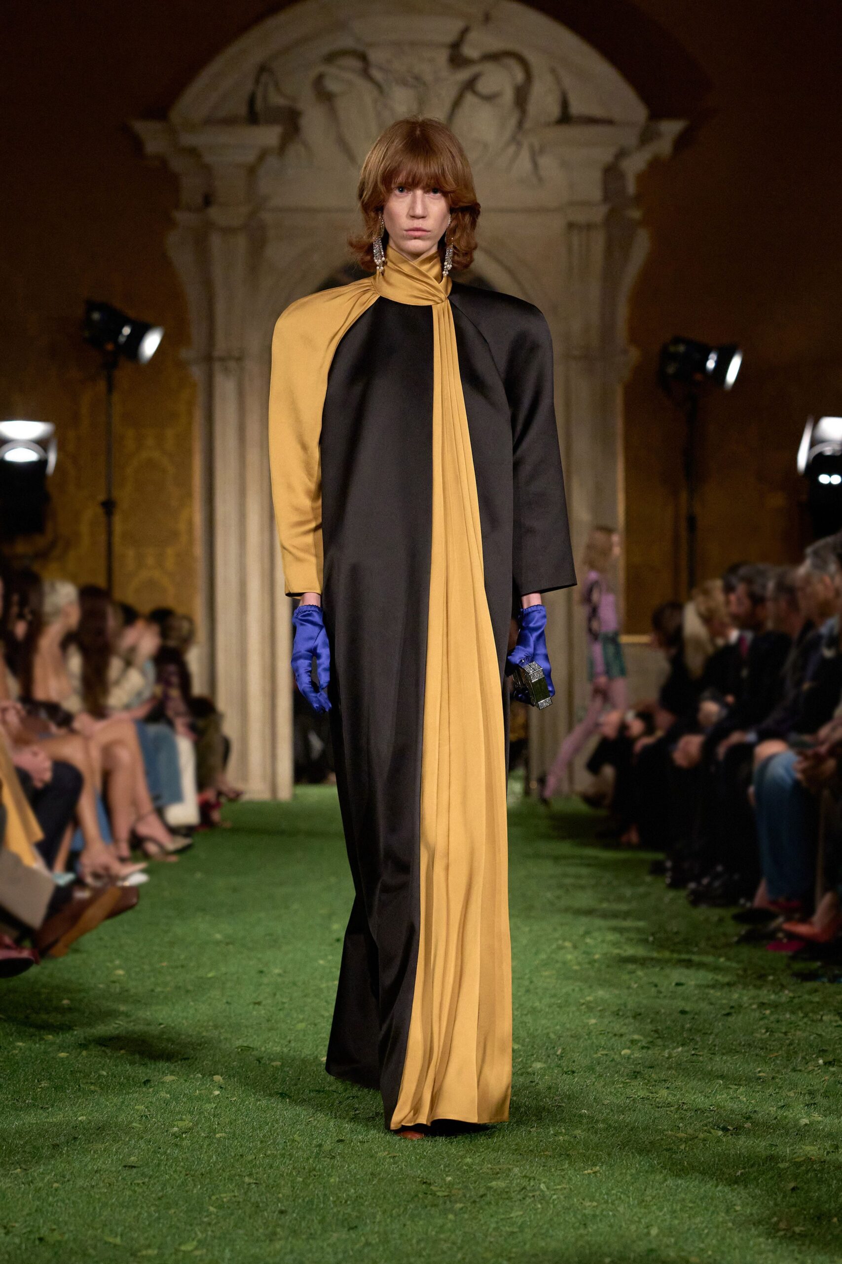 black and yellow draped maxi dress with blue gloves