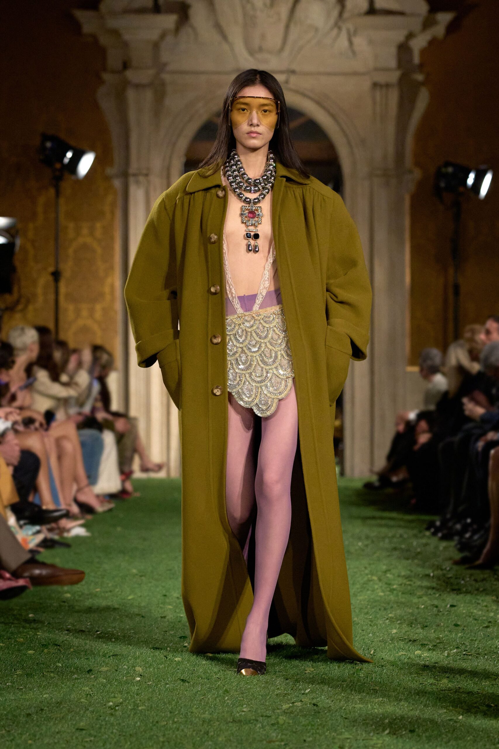 oversized green coat with embellished top and skirt