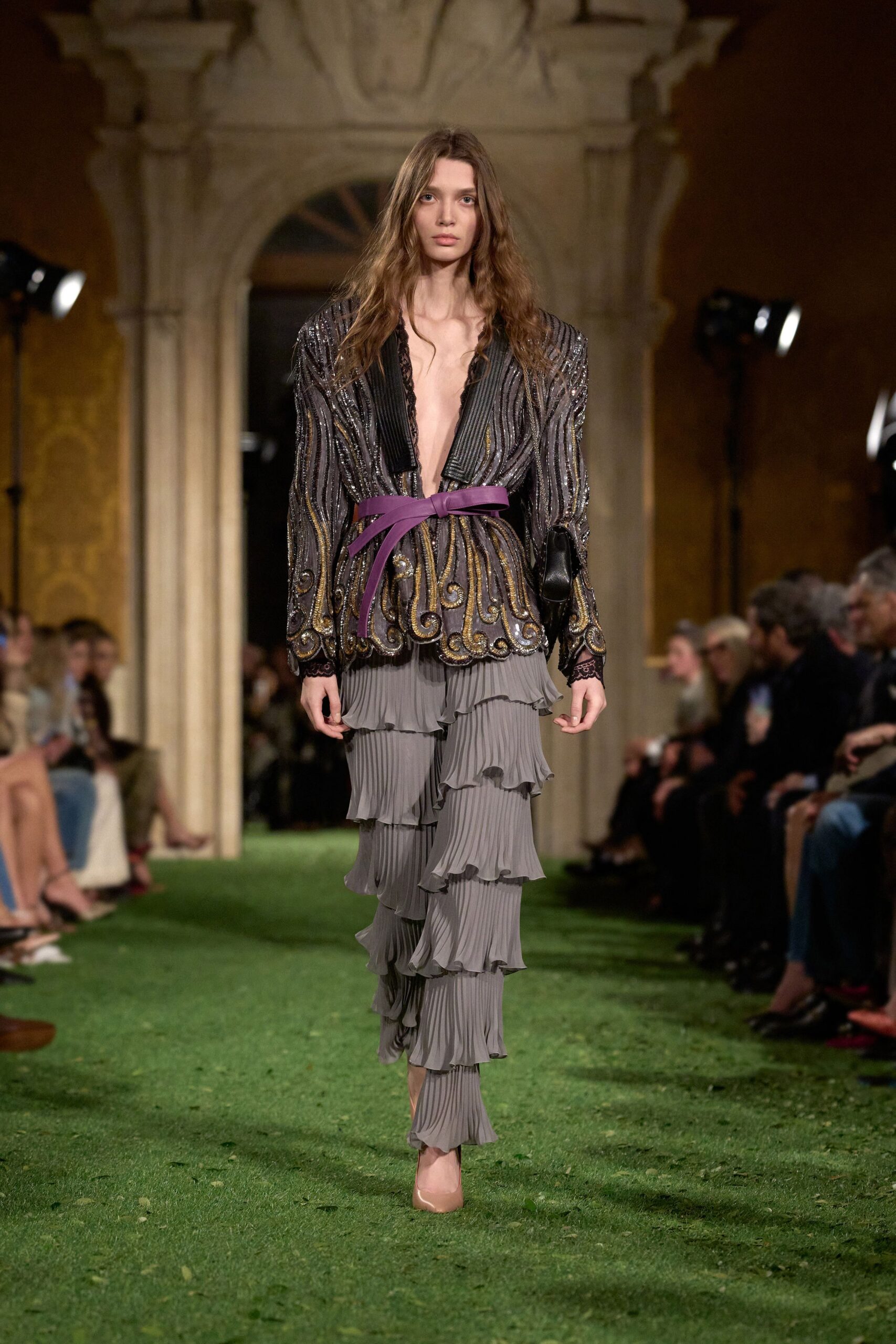 black embroidered blouse with gray pleated pants
