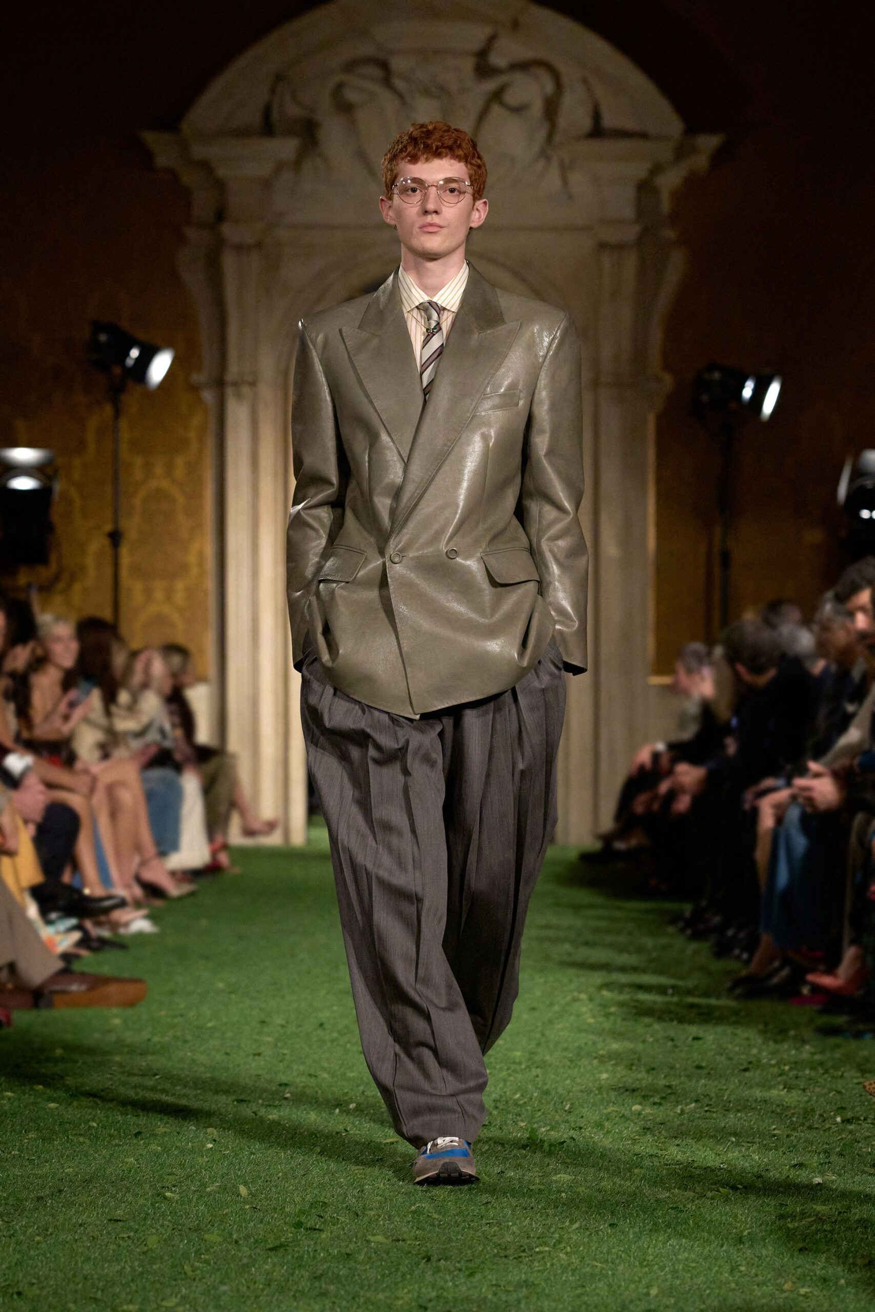 oversized green leather blazer with relaxed gray pants