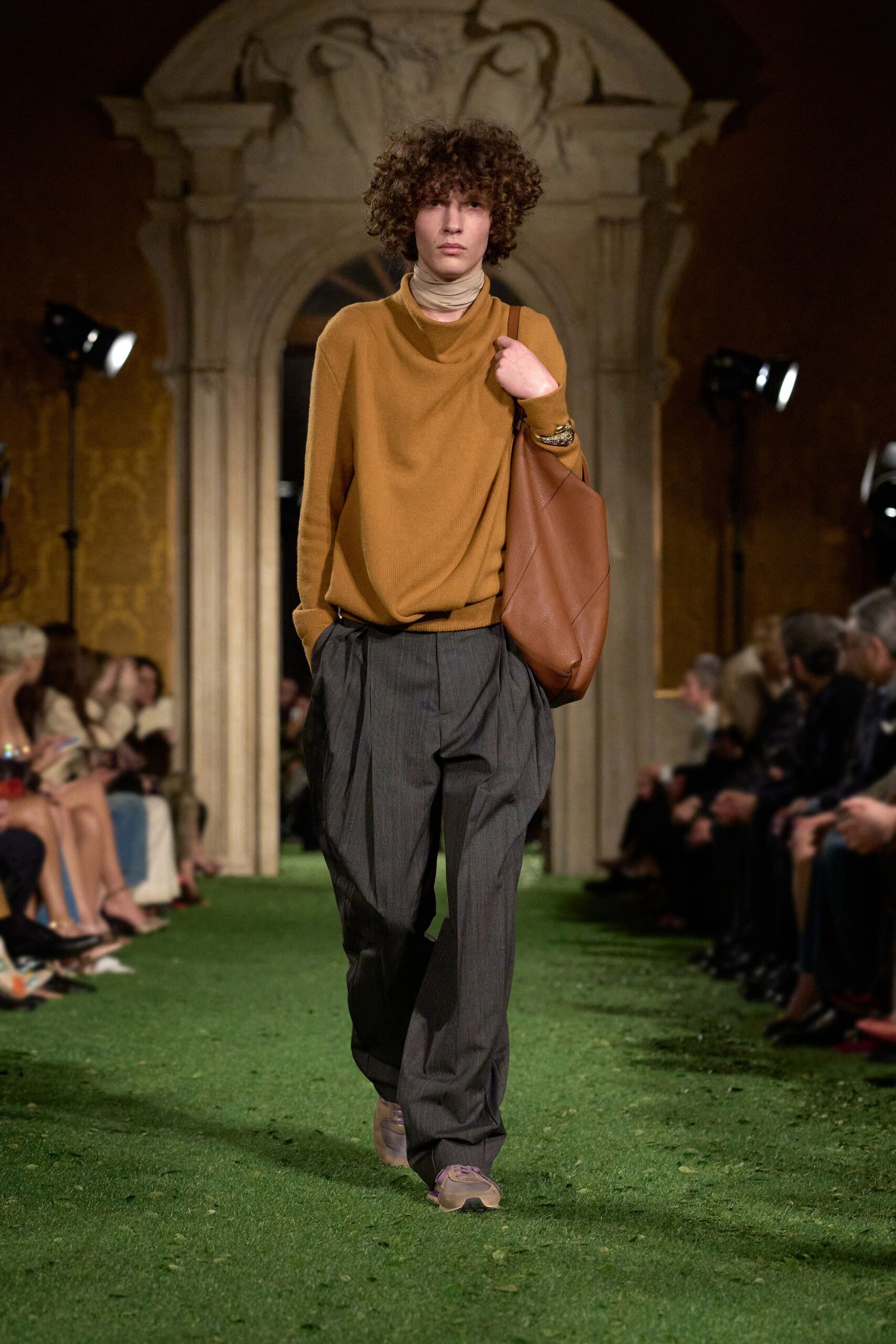 orange turtleneck top with gray pants