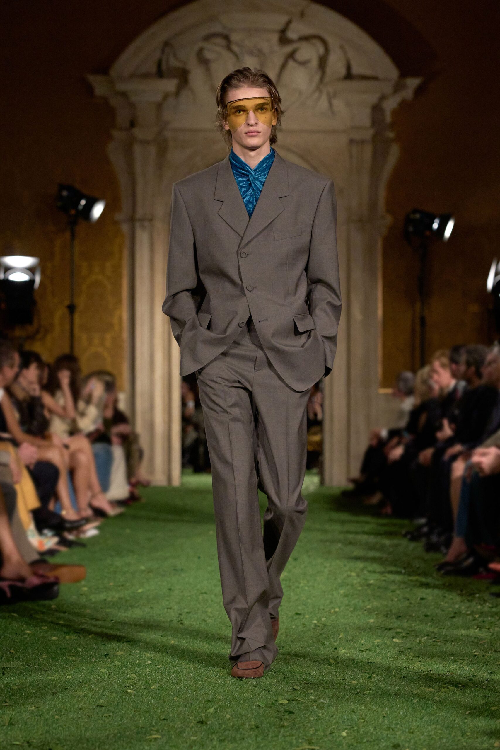 gray tailored suit with blue shirt